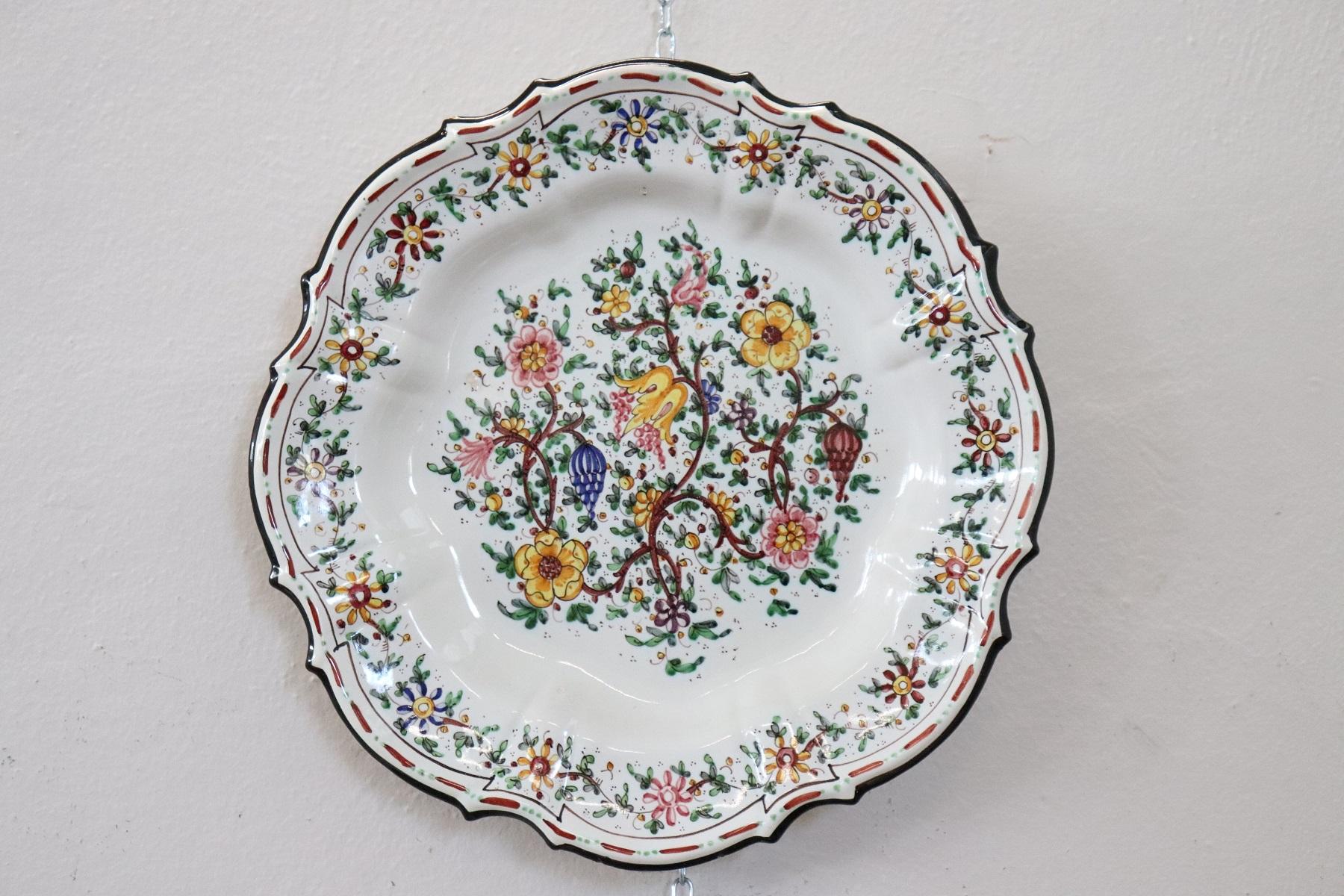 Refined pair of ceramic plates hand painted Italian important manufacture signed to the back C.A.M. Gubbio. Company active from 1932-1955 the production is the work of the ceramics artist Giovanni Notari. Refined painting with colored flowers.