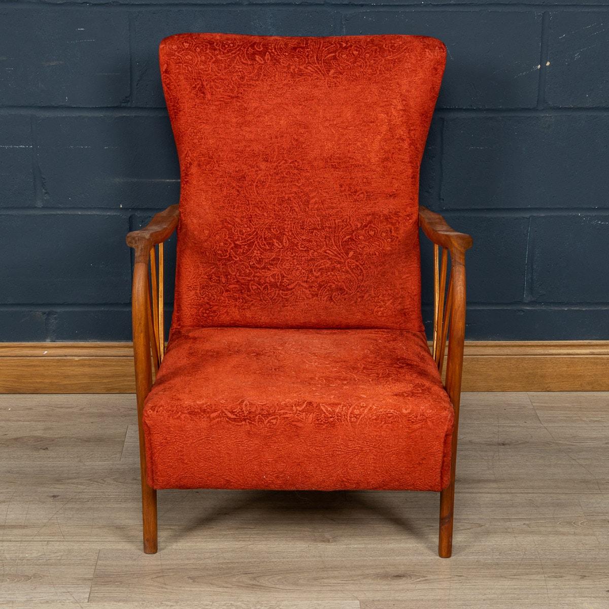 A lovely and very rare armchair or easy chair made in Italy in the middle part of the 20th century. The chair has possibly been reupholstered in a sumptuous red floral fabric, in keeping with the style and age of the chair. What really sets this