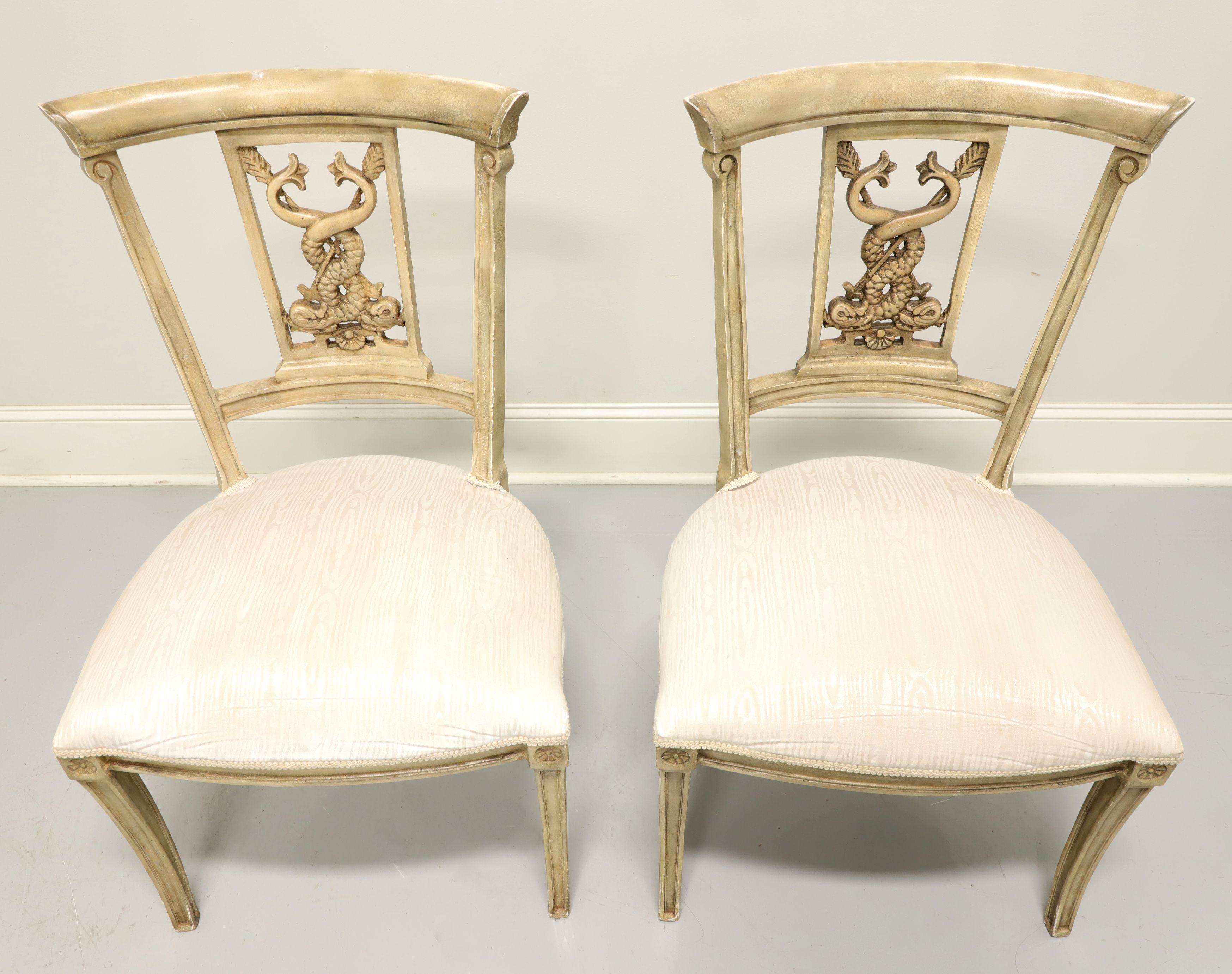 A pair of side chairs in the Italian Impero style, unbranded. Moulded heavy composite material in a pale brown color, smooth crest rail, serpent shaped back rest, cream colored satin like fabric upholstered seat, medallions to knees, and saber legs.