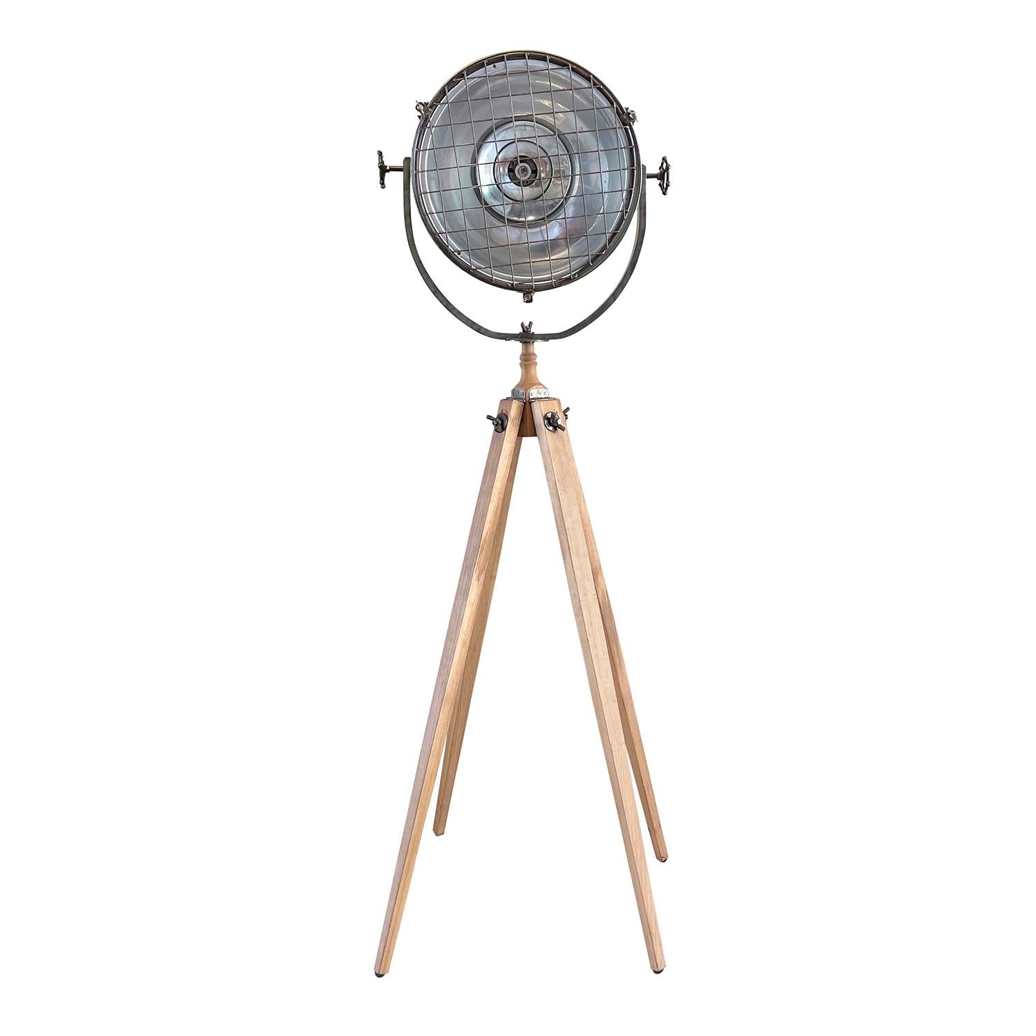 A vintage Industrial style Italian spotlight made of hand crafted metal, in good condition. The detailed theater floor studio lamp is composed with a large adjustable shade, featuring a single light socket, consisting its original hardware, standing