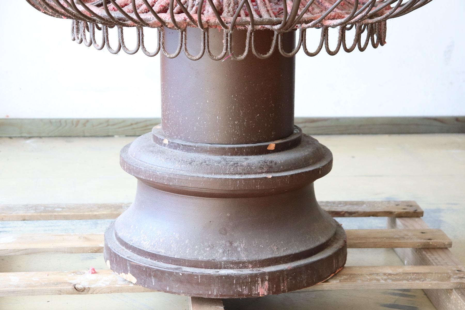 Rare large candelabrum in forged iron with 11 arms for 11 candles. The base is in terracotta and is revolving. In use for many years to illuminate the entrance of an ancient Italian home. The ancient wax used over the centuries still visible is very