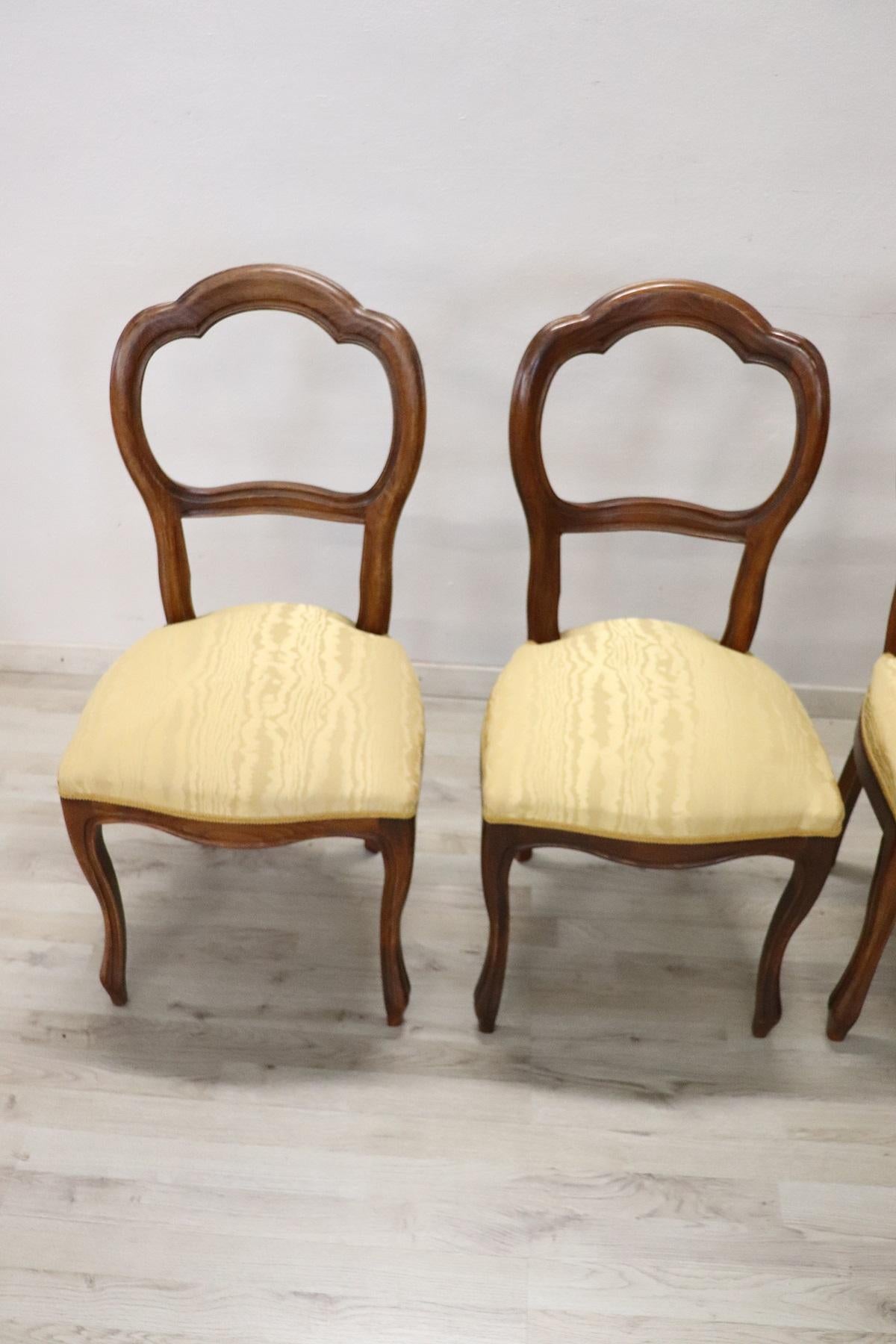 Series of refined Italian Louis Philippe style four chairs in solid beechwood. The legs are very elegant. The seat is wide and comfortable with yellow cloth. The chairs are used good conditions. Small stain on a chair. Please look good all the