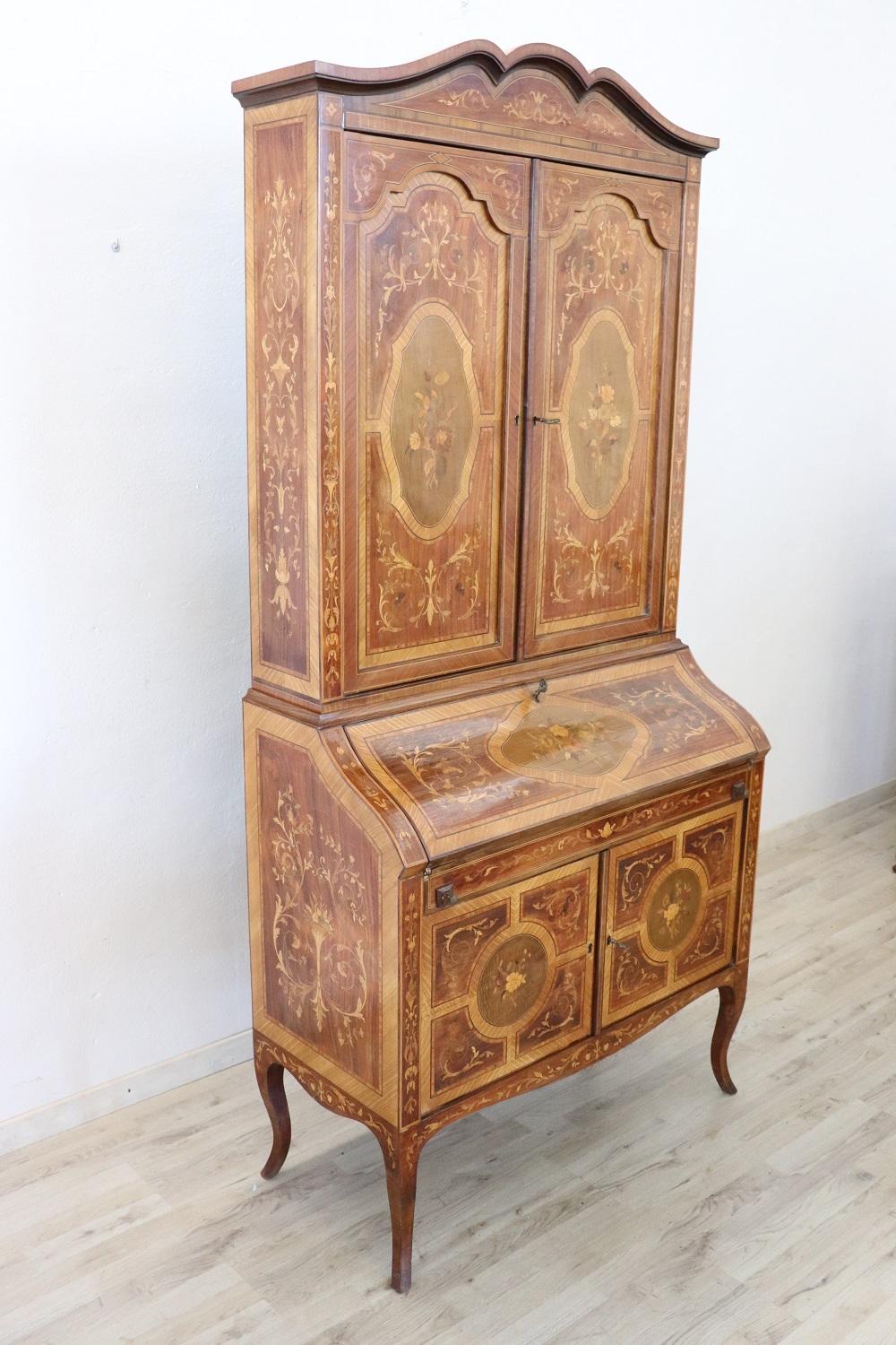 Elegant cabinet in precious inlaid walnut 1930s. This cabinet is characterized by a refined inlay work with neoclassical decorations. The inlay is made using many different precious woods such as maple, rosewood etc. We advise you to look in detail