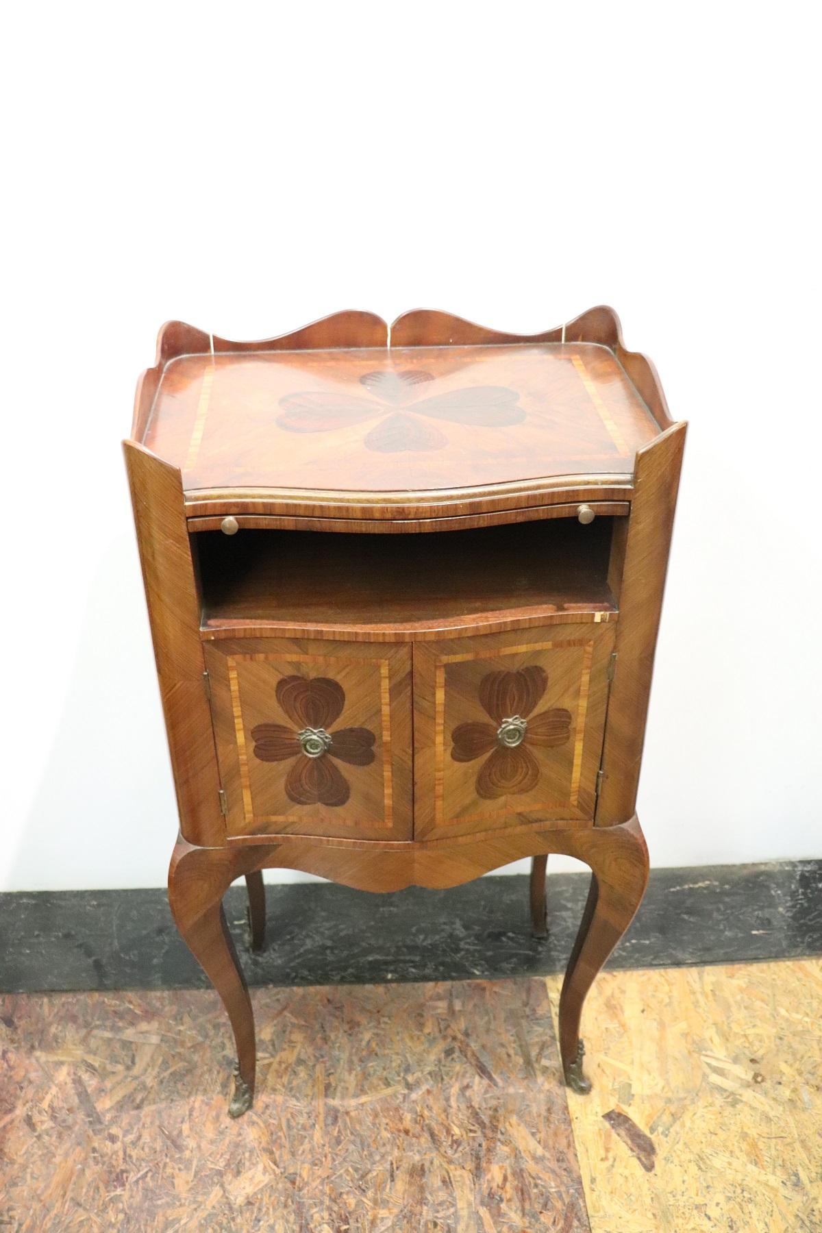 Rare and fine quality Italian Louis XV style 1930s side table or nightstand in inlay wood. The table has a particular legs slender. Fine floral inlay decoration on the sides with cloverleaf. The four-leaf clover in Italy is a plant considered to