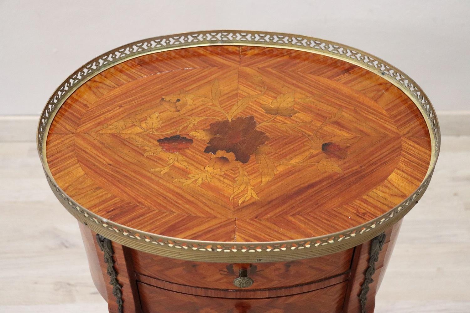 Rare and fine quality Italian Louis XV style 1970s side table or nightstand in inlay wood with floral taste decoration. The side table has a particular bean shape, the legs are long and slender. The decoration is on each side so you can place the