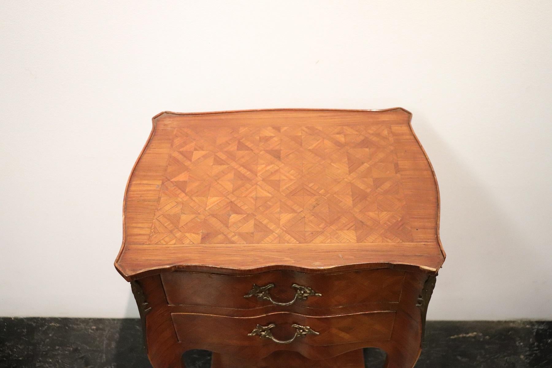 Rare and fine quality Italian Louis XV style, 1930s side table or nightstand table. The table has a particular legs slender. Fine inlay marquetry decoration in precious rosewood. On the front two comfortable little drawers. The finely chiselled