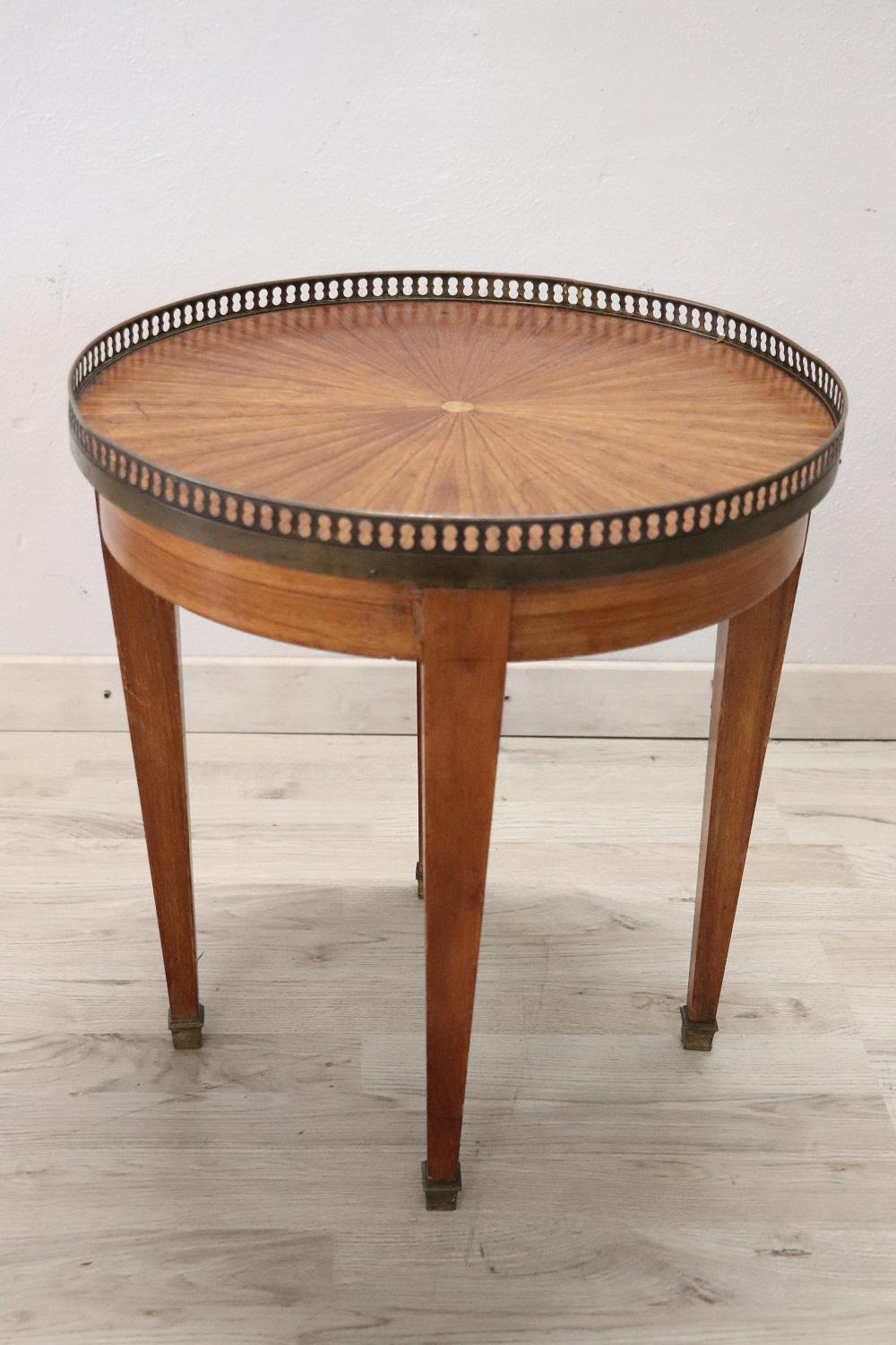 Rare and fine quality Italian Louis XVI style 1930s side table in walnut wood with with the decoration in wedges. The side table has a particular straight shape. Precious decorations in finely chiseled bronze. In vintage perfect conditions.