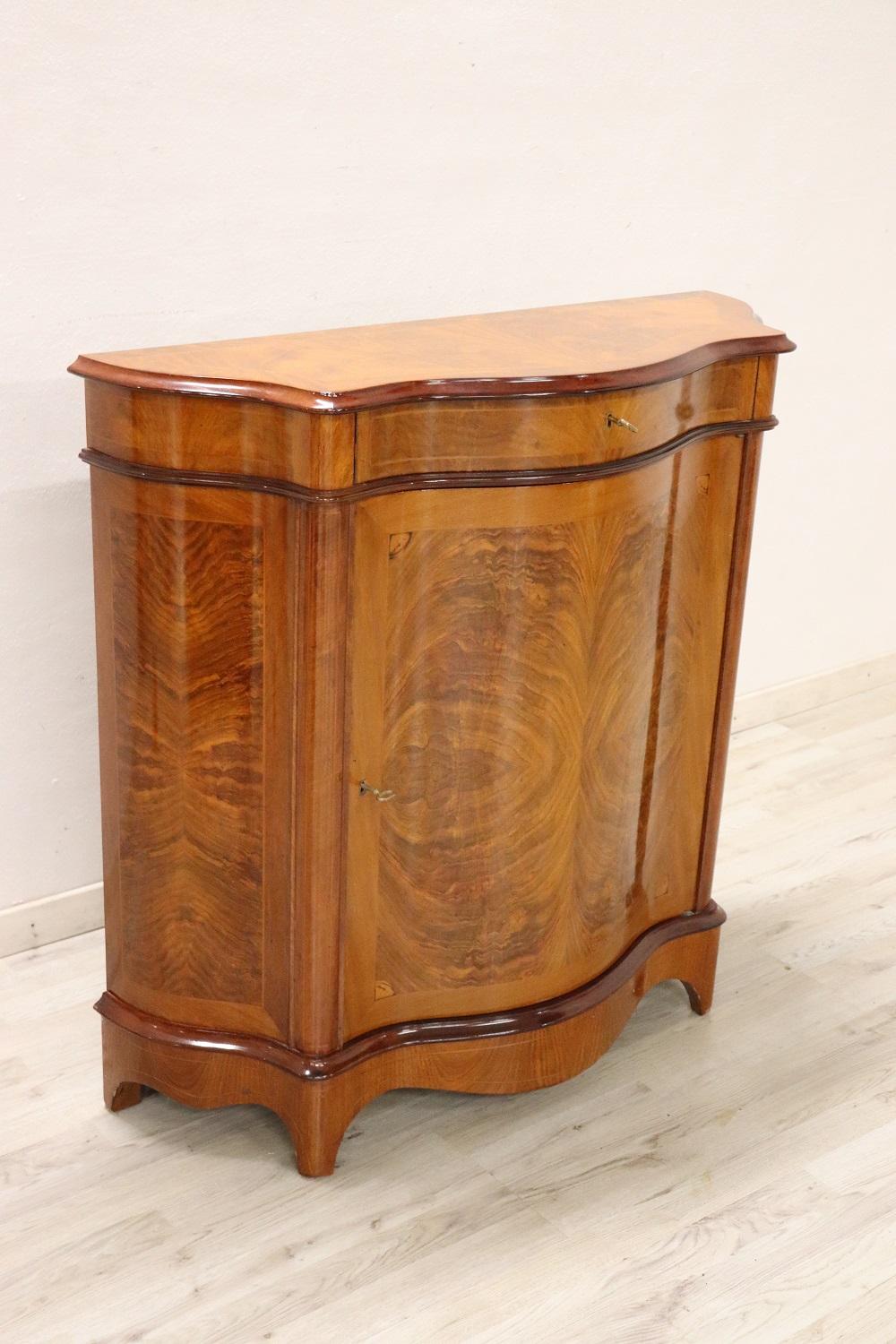 Elegant cabinet in mahogany wood, 1950s. Lots of useful internal space. A small and comfortable drawer. Particular shape on the front. Truly elegant and important for any room in the house. You will receive this cabinet in peerfect conditions, ready