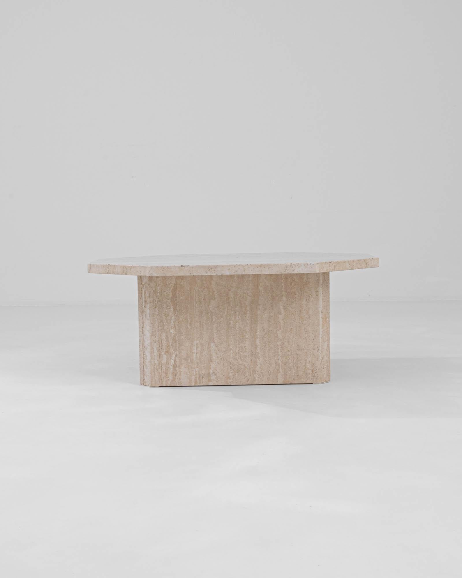 Introducing the 20th Century Italian Marble Coffee Table – a sculptural triumph that brings the luxury and timeless appeal of Italian design right into your living room. Crafted from a single block of marble, this table epitomizes the minimalist