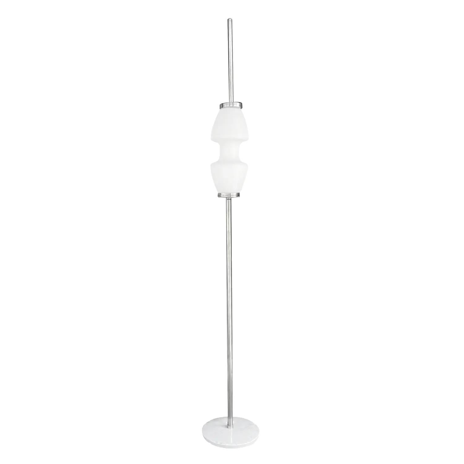 A silver, vintage Mid-Century modern Italian floor lamp made of hand crafted metal and steel, in good condition. The small floor lamp is composed with a detailed frosted opaline glass shade which features a two light socket and is standing on a