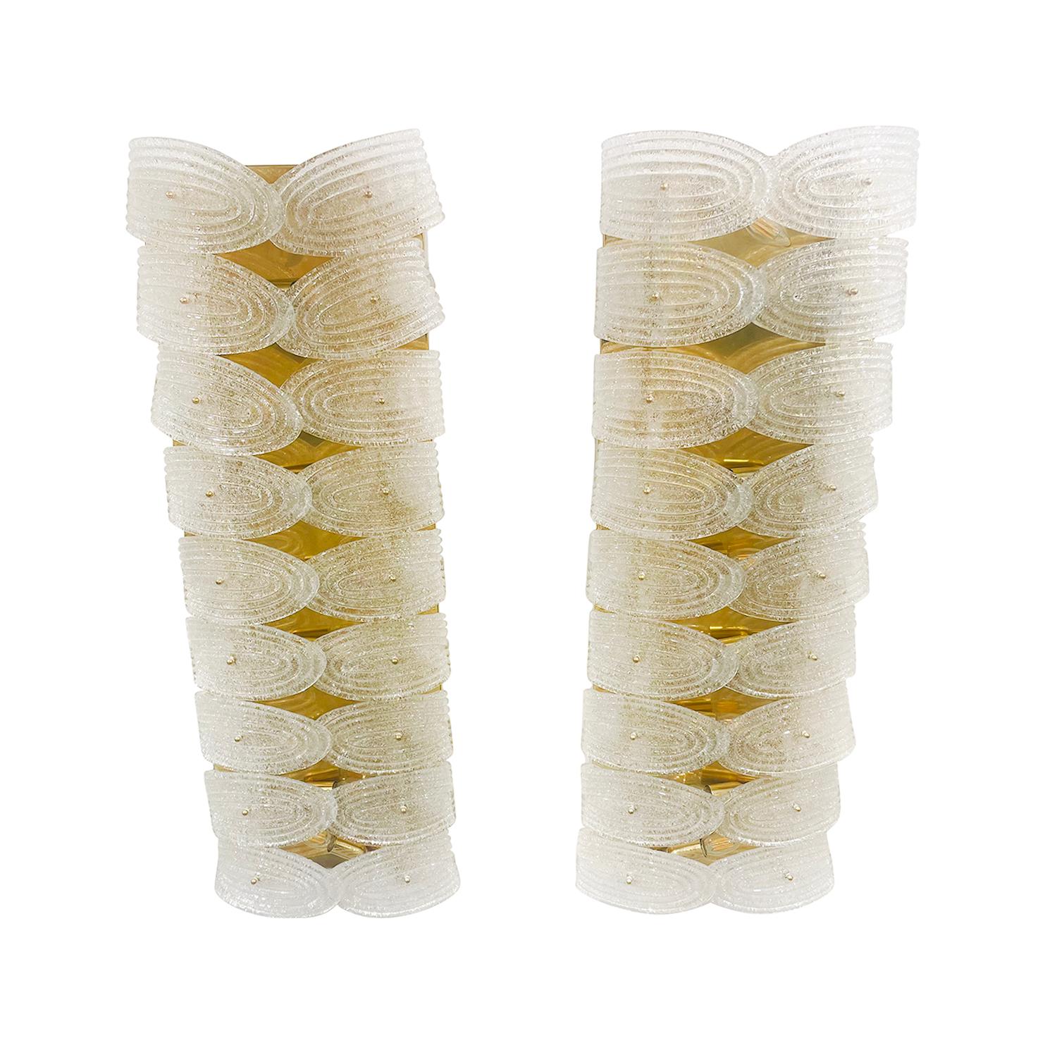 A large, vintage Mid-Century modern pair of Italian leaf wall sconces made of hand blown smoked Murano glass, in good condition. Each of appliques are composed with eighteen slightly frosted glass pieces, rays which are halted by a short arm,