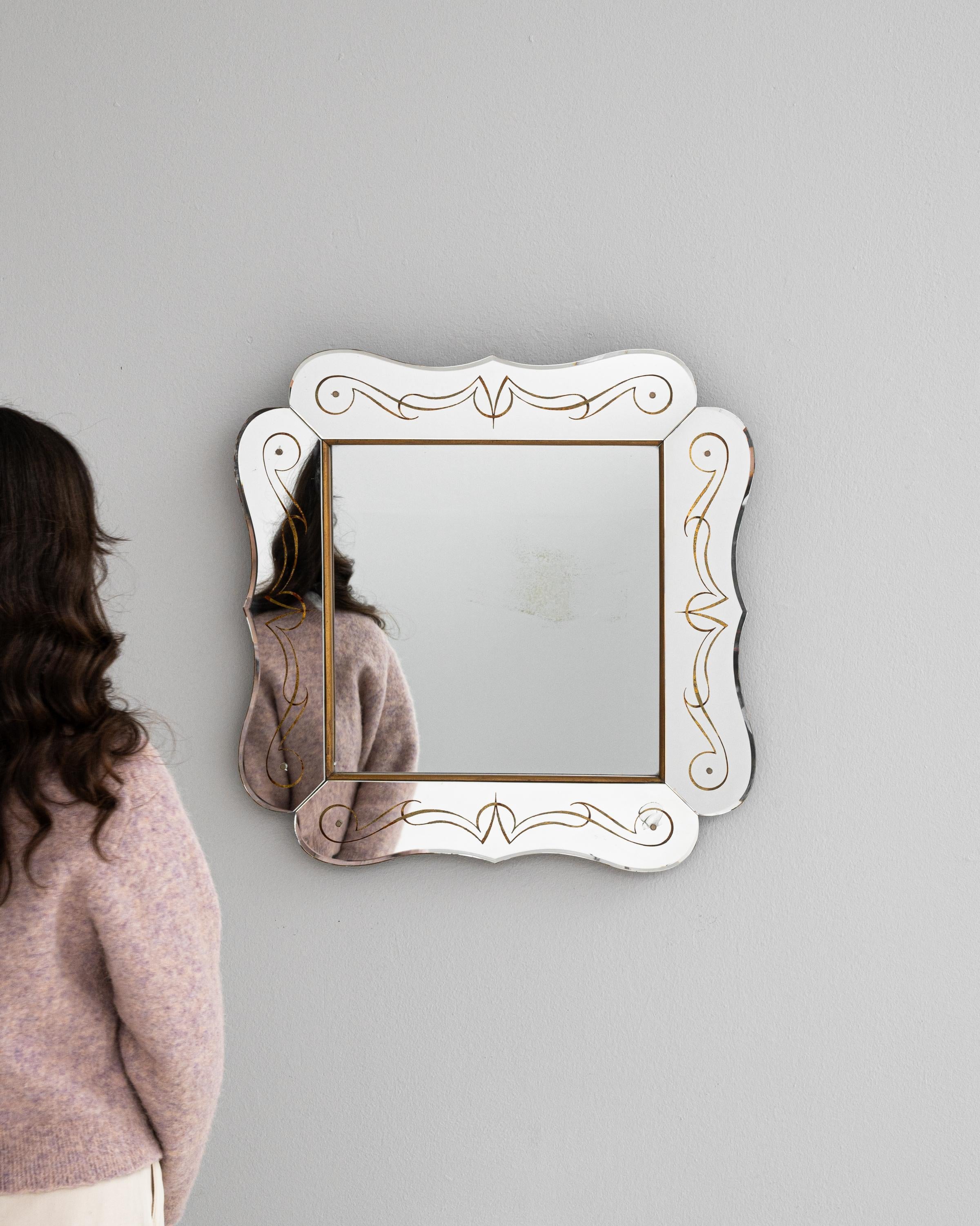 Step into a world of vintage luxury with this captivating 20th Century Italian Mirror, where classic design meets playful sophistication. The charming white frame, accented with graceful gold swirls, exudes an air of opulence and delicate artistry.