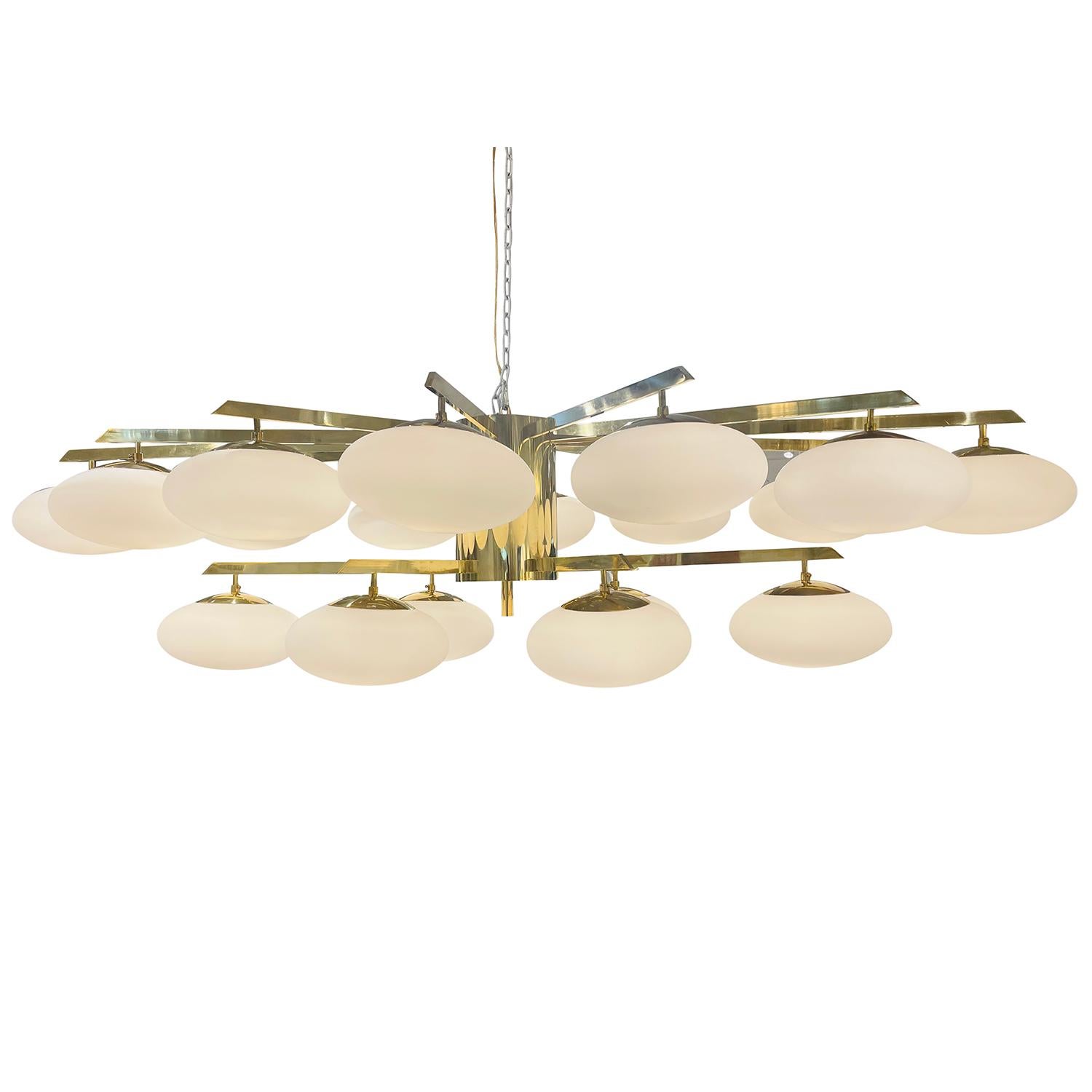 A large, vintage Mid-Century modern Italian chandelier made of hand blown frosted opaline glass designed and produced by Stilnovo, in good condition. The detailed rectangular pendant is particularized by seventeen half rounded glass shades which are