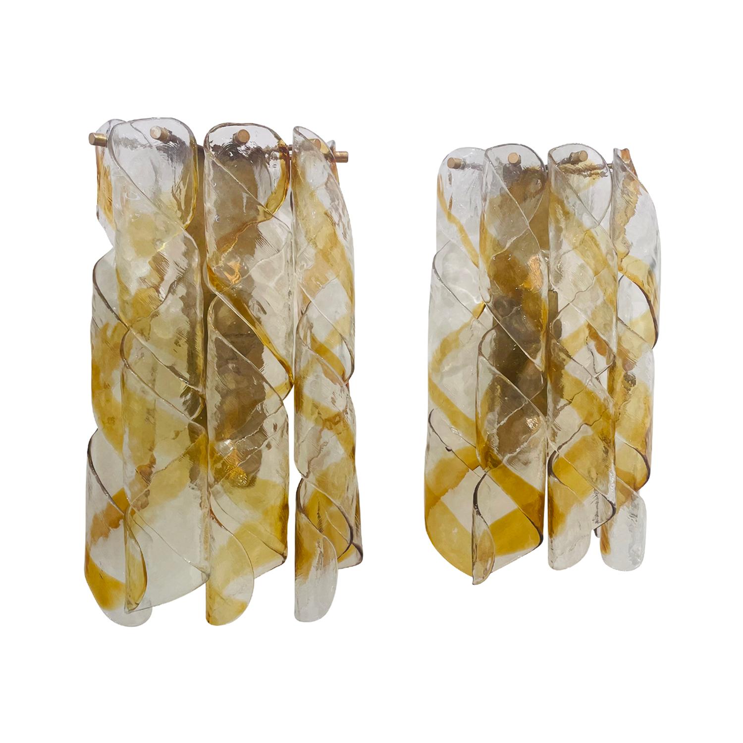 A colorful, vintage Mid-Century modern pair of Italian wall sconces, appliques made of hand blown smoked Murano glass produced by Mazzega, in good condition. Each wall light, lamp is composed with five yellow and white twisted glass pieces which are
