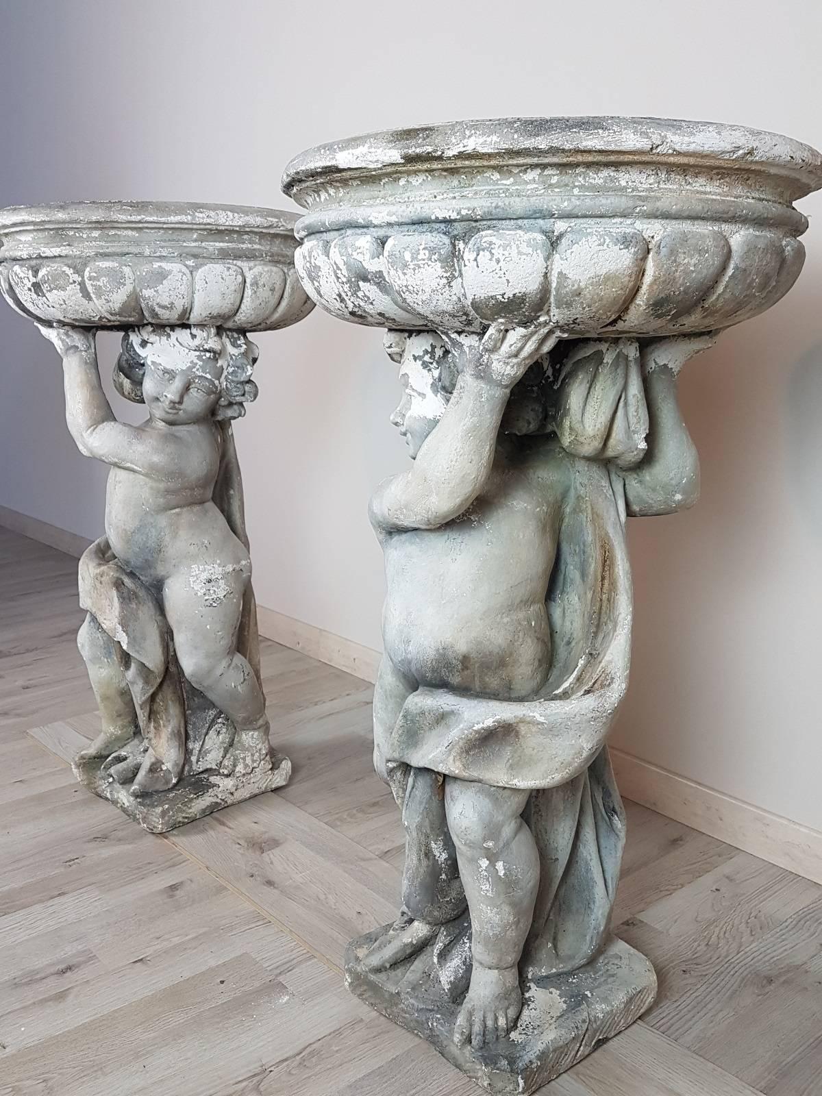 Pair of cherubs with garden pots made of cement, circa 1950, about outdoor furniture, dimensions of great effect, refined realization. Perfect state of conservation. Beautiful Italian garden furniture!