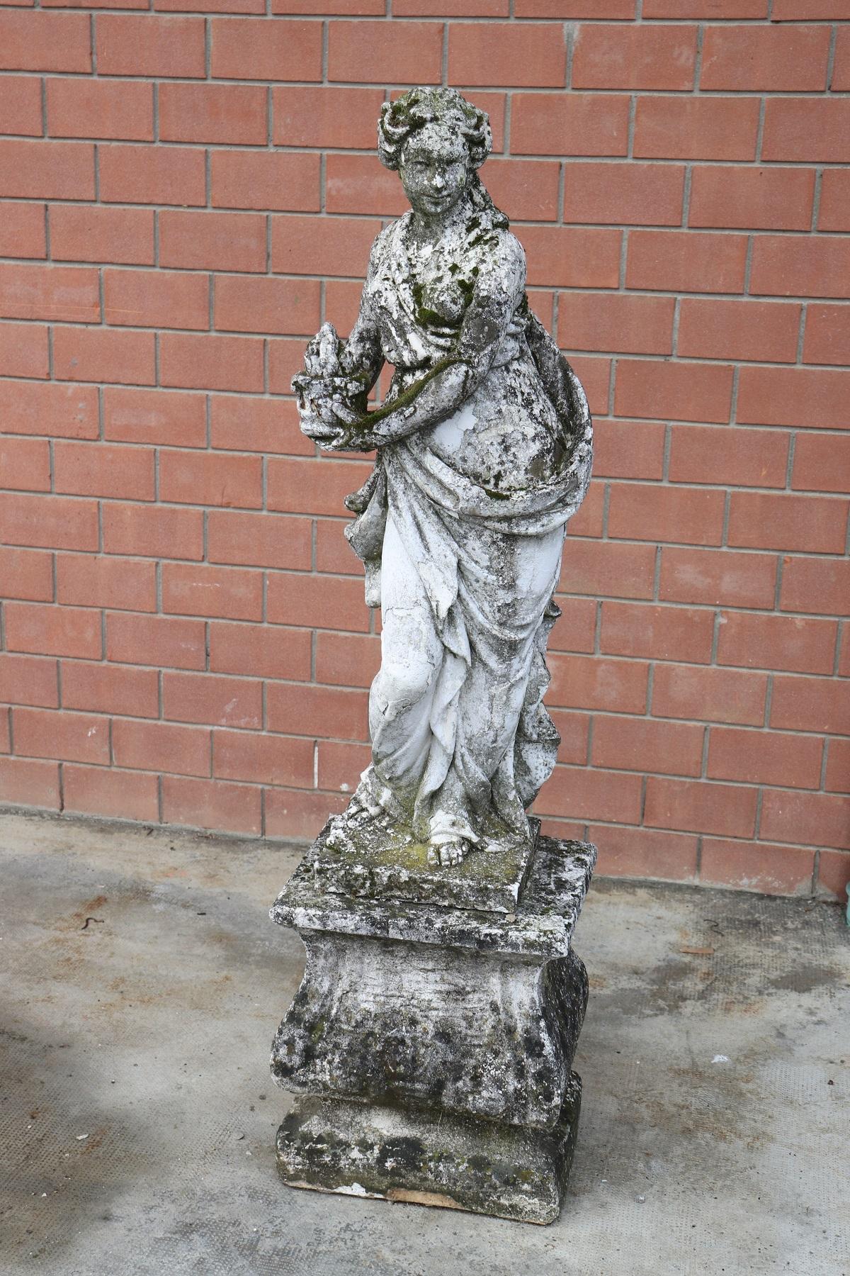 Beautiful refined garden statue in neoclassical style, circa 1930s main material stone mixed with gravel and cement. Beautiful and majestic statue. The stone shows signs of the passage of time. This statue is perfect for embellishing an important