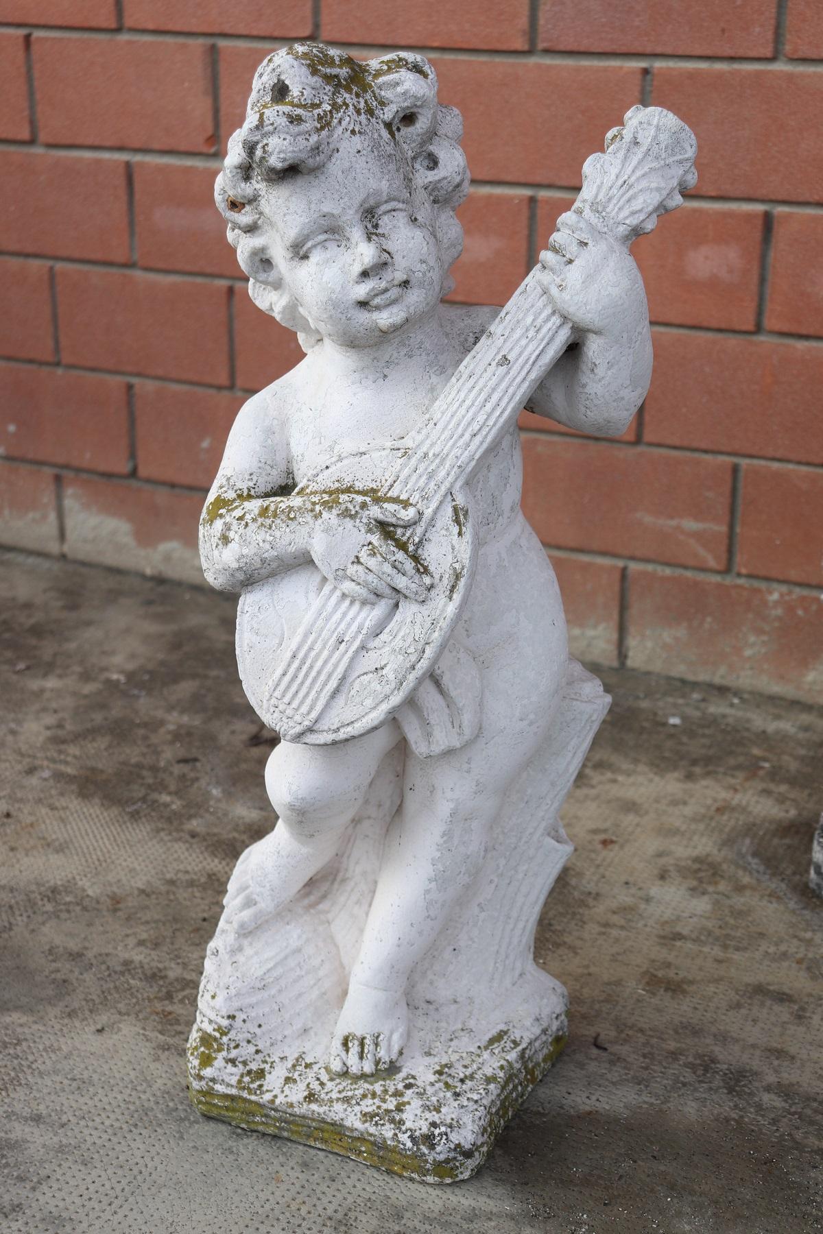 Beautiful refined garden statue set of four in neoclassical style, circa 1930s main material stone mixed with gravel and cement. Beautiful and majestic statue. The stone shows signs of the passage of time. This statue is perfect for embellishing an