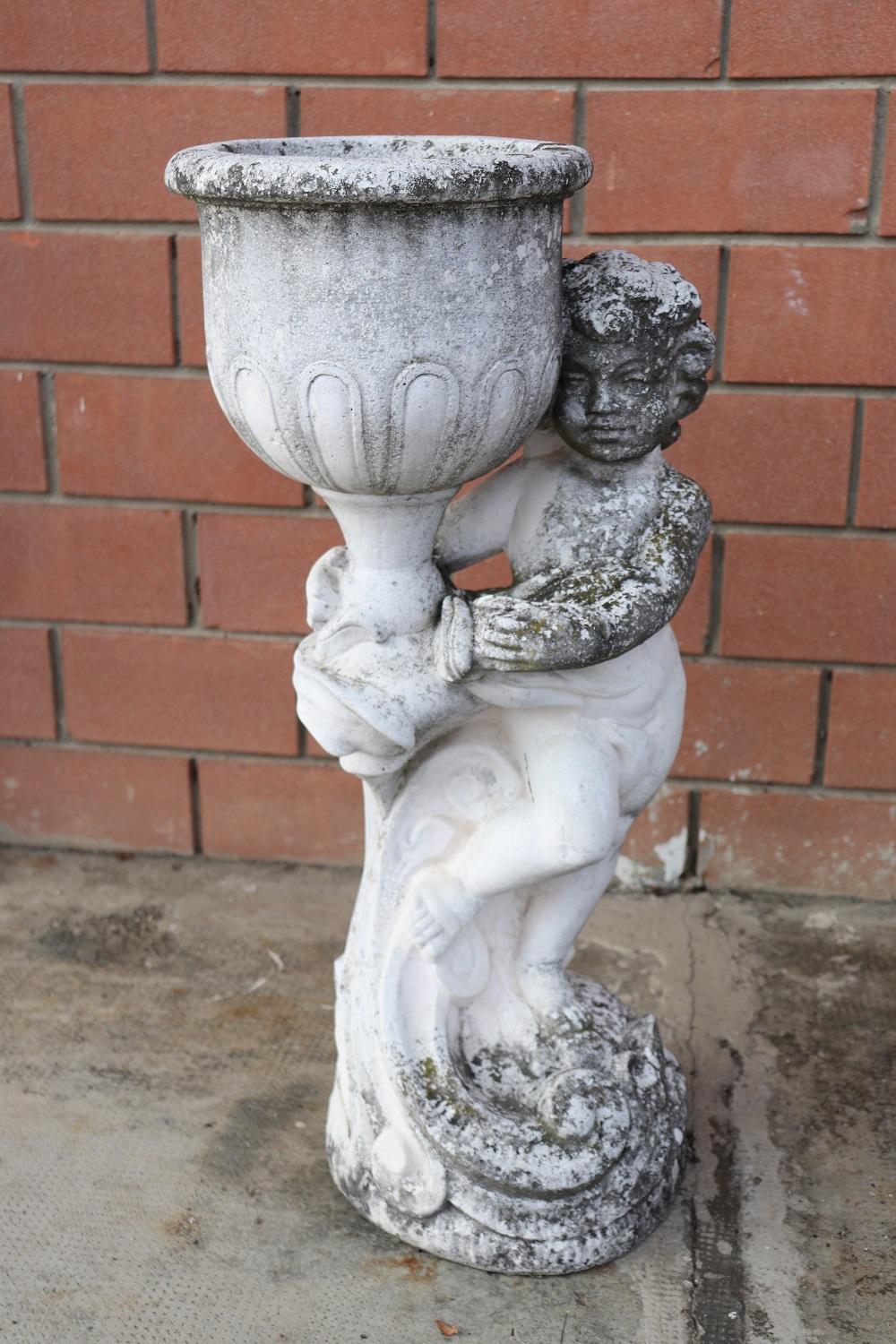 Beautiful refined garden statue with vase set of two in neoclassical style, circa 1930s main material stone mixed with gravel and cement. Beautiful and majestic statue. The stone shows signs of the passage of time. This statue is perfect for