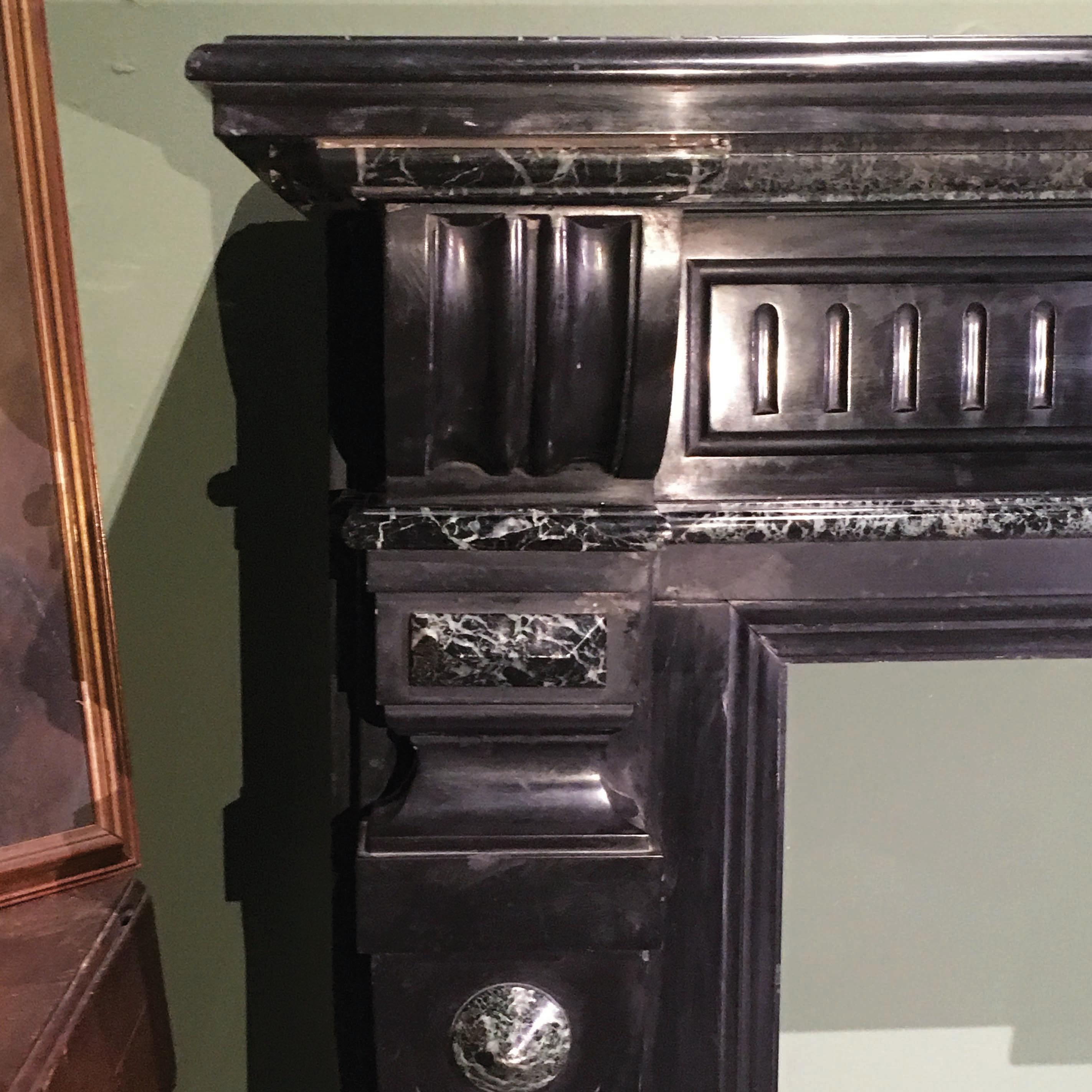 An elegant Tuscan marble fireplace from the early 20th century.
The fireplace presents two beautiful qualities of marble - the Belgian black marble 