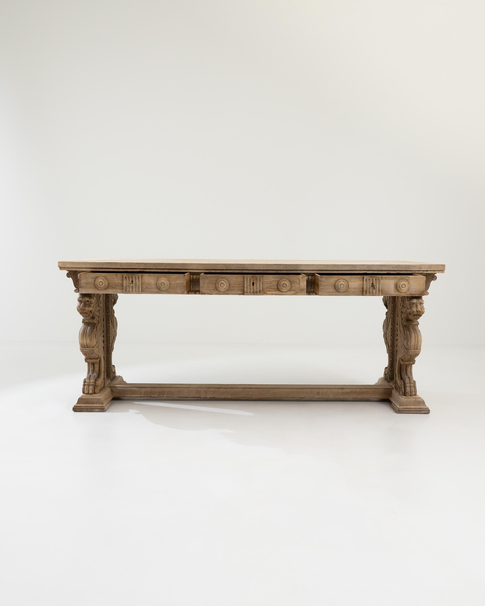 Majestic and beautifully crafted, this vintage oak dining table makes a one-of-a-kind centerpiece. Hand-built in Italy in the 20th century, the design recalls the ornate furniture of Renaissance palaces and villas. The trestle legs are carved into