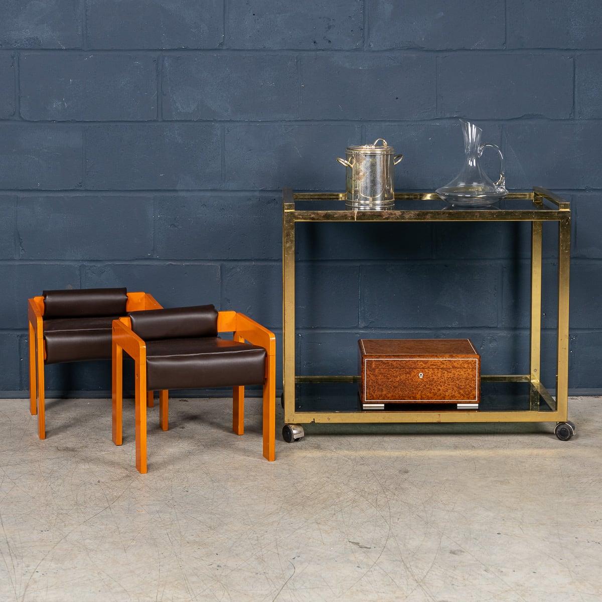 An unusually rare and charming pair of children's armchairs, crafted in Italy in the 1980s. showcasing the influence of Bauhaus design principles, applied to a diminutive scale. Inspired by the Bauhaus movement's commitment to functionality,