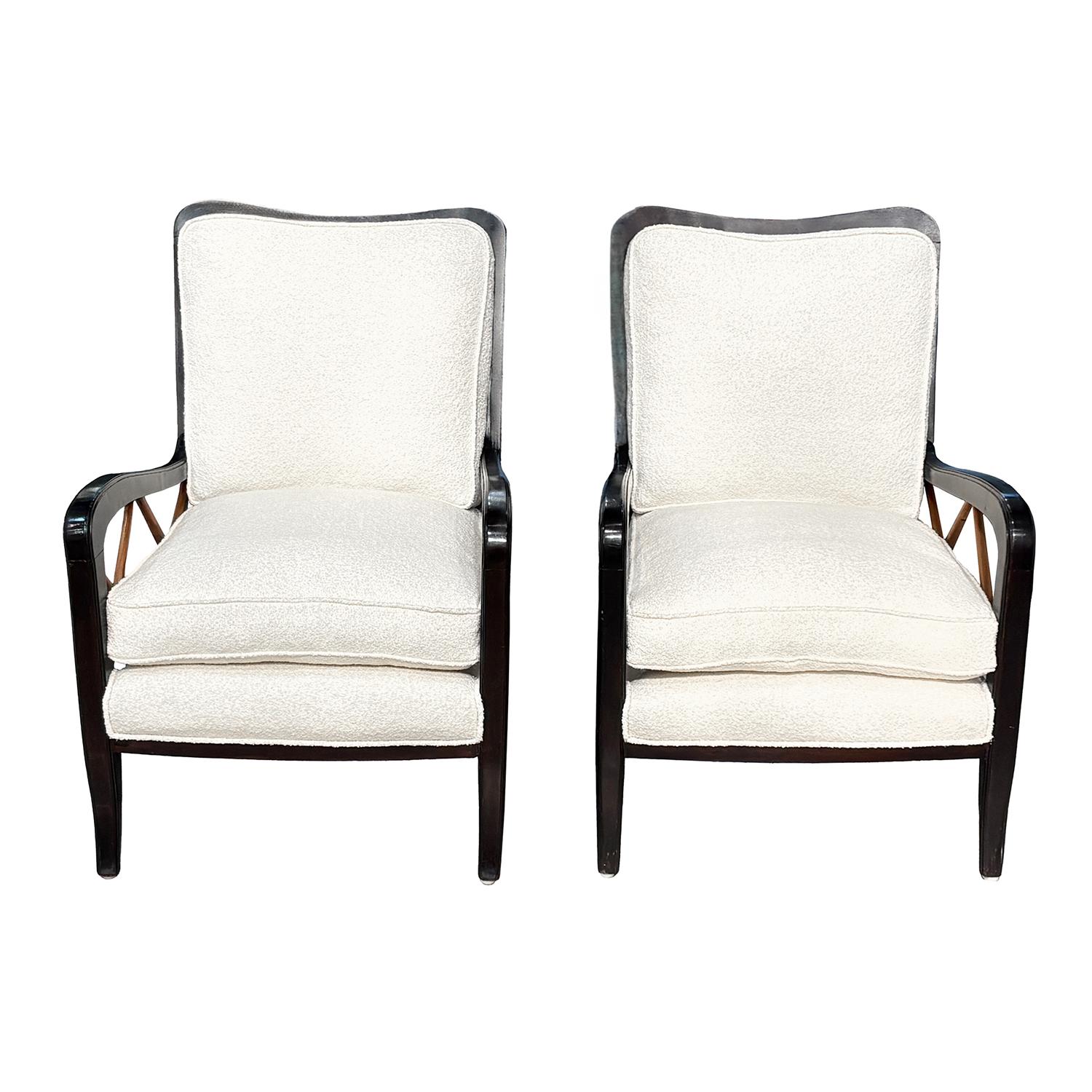 A vintage pair of Mid-Century modern Italian lounge chairs made of hand crafted Walnut designed by Paolo Buffa, in good condition. The detailed club armchairs are composed with a long backrest, the detailed splined sides are made of polished