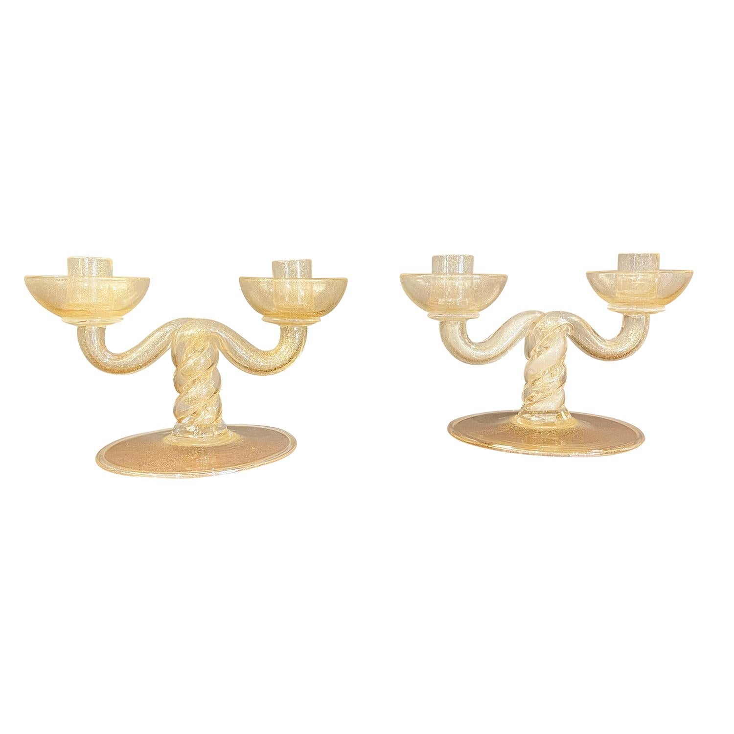 A vintage Mid-Century Modern Italian pair of candleholders made of hand blown Pulegoso Murano glass, designed and produced by Barovier & Toso, in good condition. Wear consistent with age and use, circa 1940-1950, Murano, Italy.

Base: 0.25