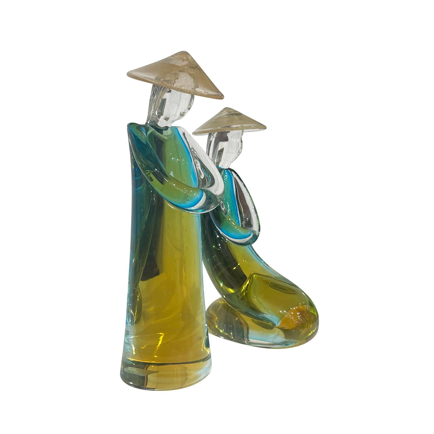 A blue-yellow, vintage Mid-Century modern Italian pair of small Japanese farmers with a large hat made of hand blown colored Murano Sommerso glass, designed and produced by Archimede Seguso in good condition. The detailed décor pieces represent a
