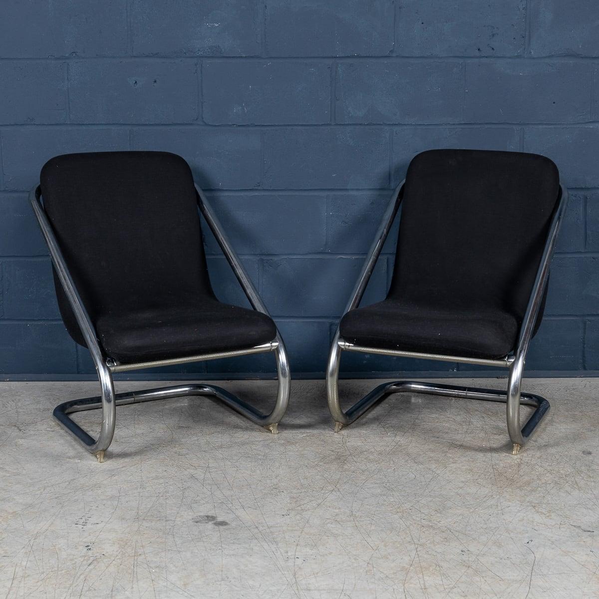 A pair of tubular-framed lounge chairs, Italy, circa 1980, epitomizes the sleek and minimalist design sensibilities of late 20th-century modernism. The tubular metal frames, likely inspired by the Bauhaus movement's emphasis on industrial materials,