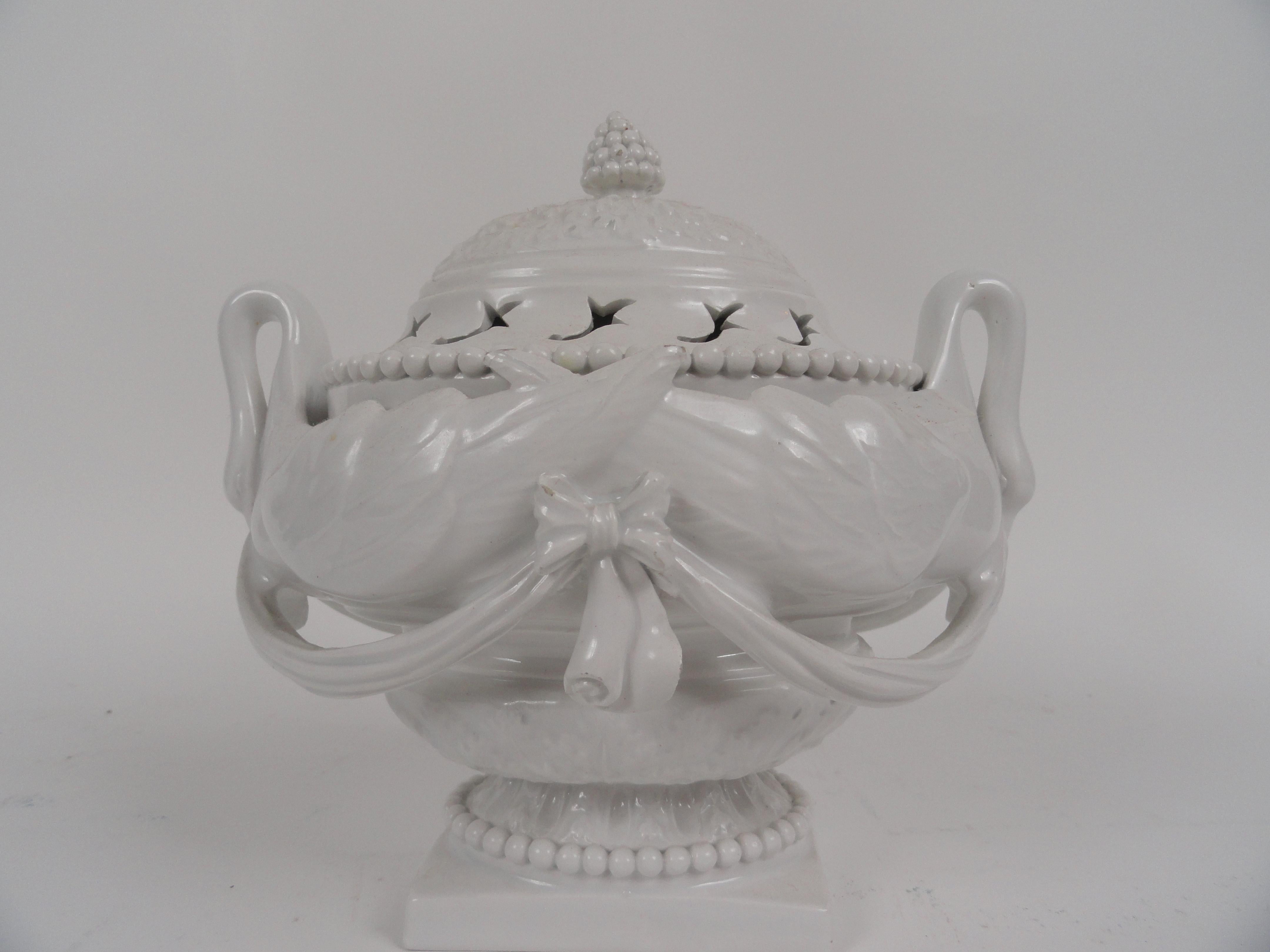 20th century Italian soft porcelain perfumery. Elliptical vessel features swan handles, draping and applied medallion. Removable lid. Stamped 