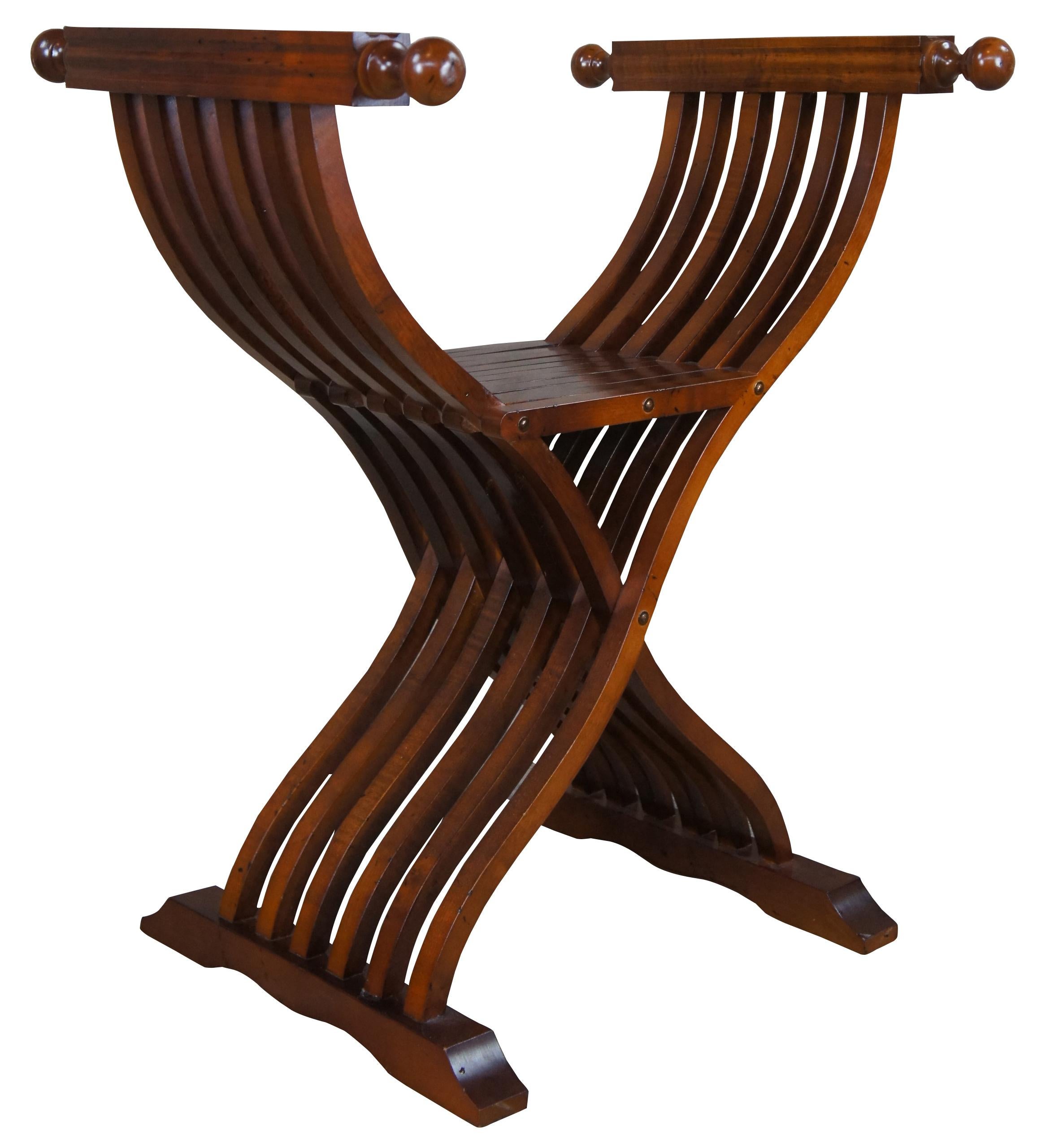 Solid mahogany Italian made Savonarola chair. Circa 1980s. Traditional styling with an X form folding base. Features square fluted arm rests leading to knobbed ends. Marked along the bottom; Made in Italy, Style no 266

Size folded - 6
