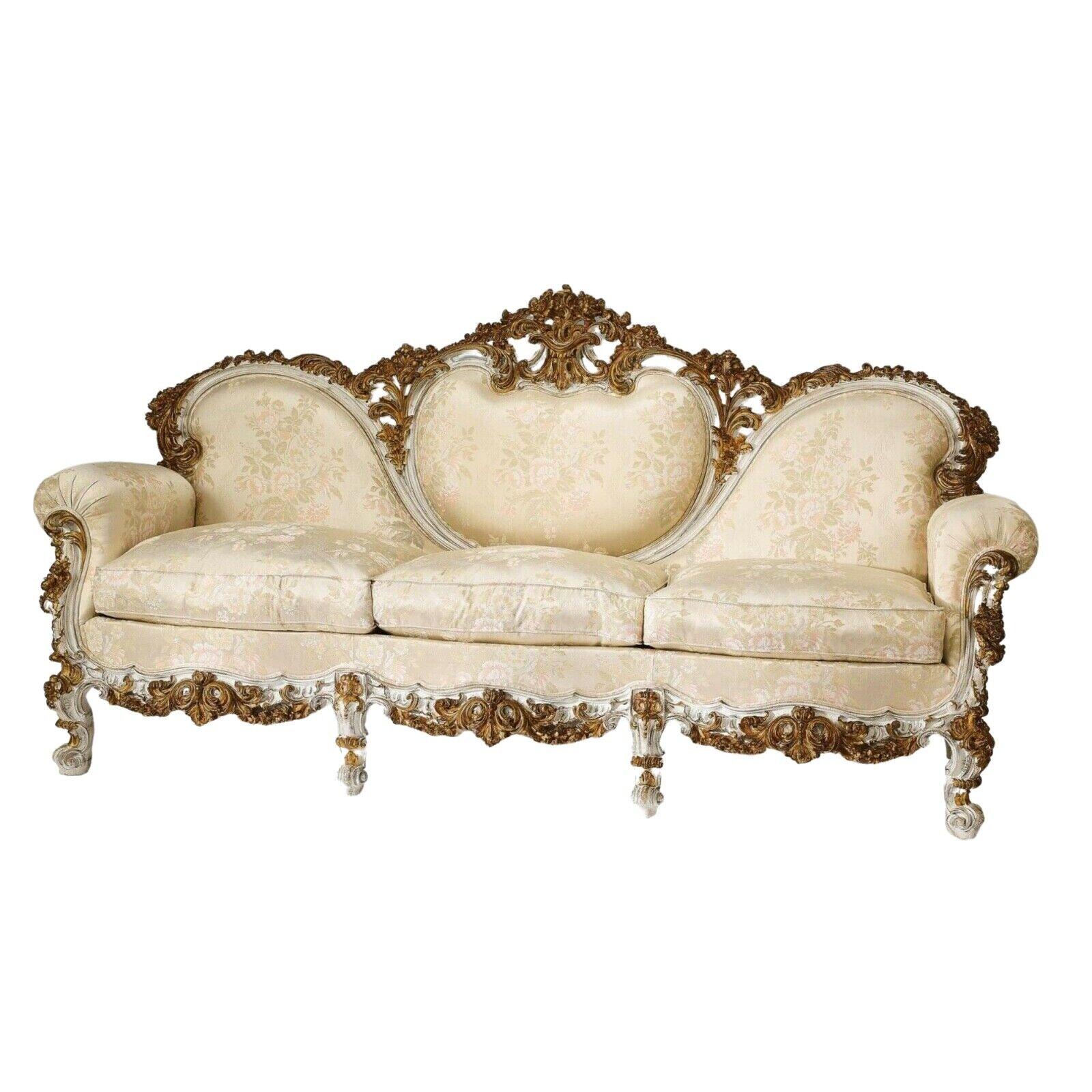Stunning sofa, Bergeres, Italian Rococo style carved and gilt, Satin Brocade, set of 3!

Pair of Italian Rococo style carved bergeres, each having a parcel gilt and paint-decorated pierce carved crest rail surmounting the cabachon back, custom