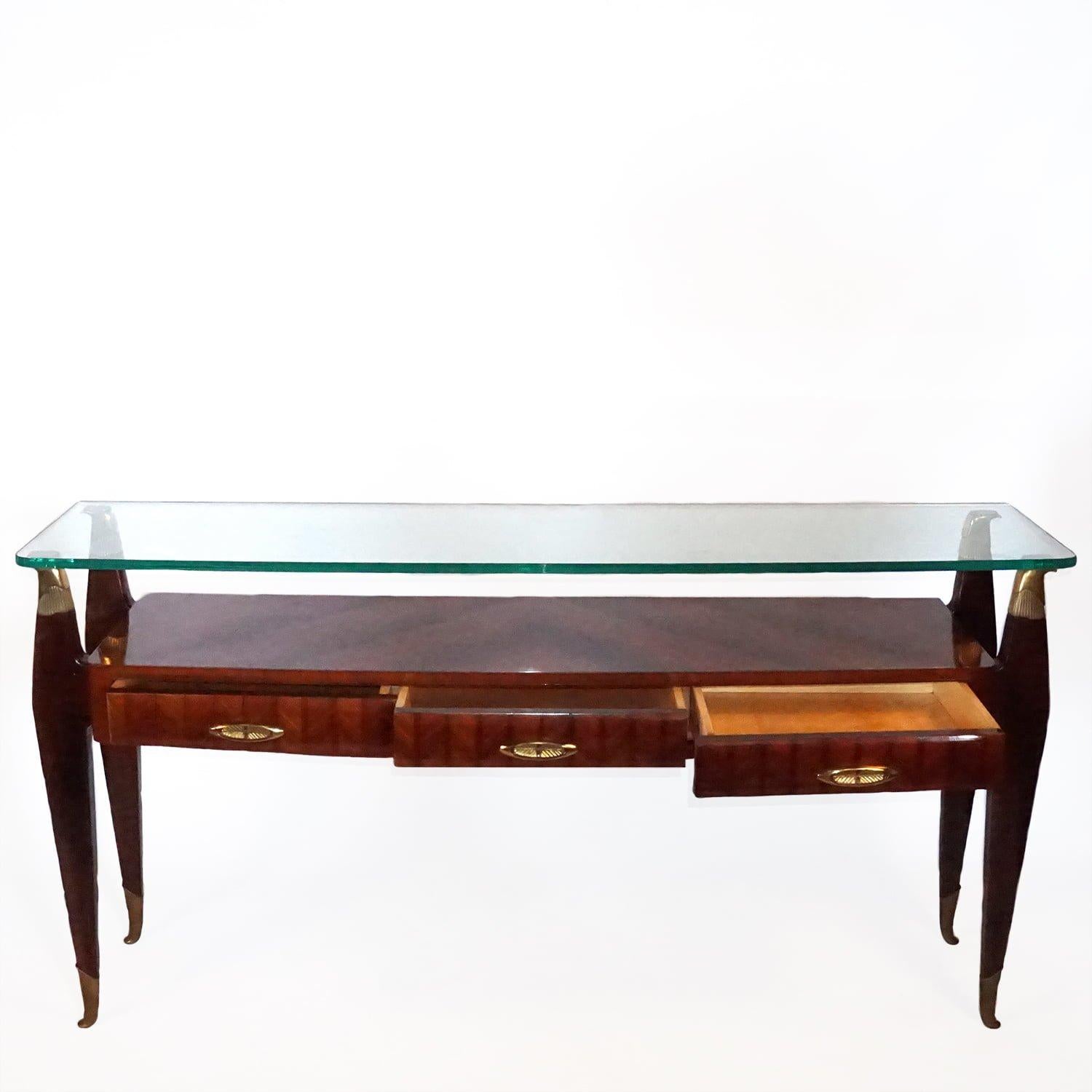 A dark-brown, vintage Mid-Century Modern Italian console table, Atelier di Varedo. Designed most likely by Osvaldo Borsani in good condition. The legs are made of hand crafted ebonized Mahogany and Rosewood with detailed brass décor and three