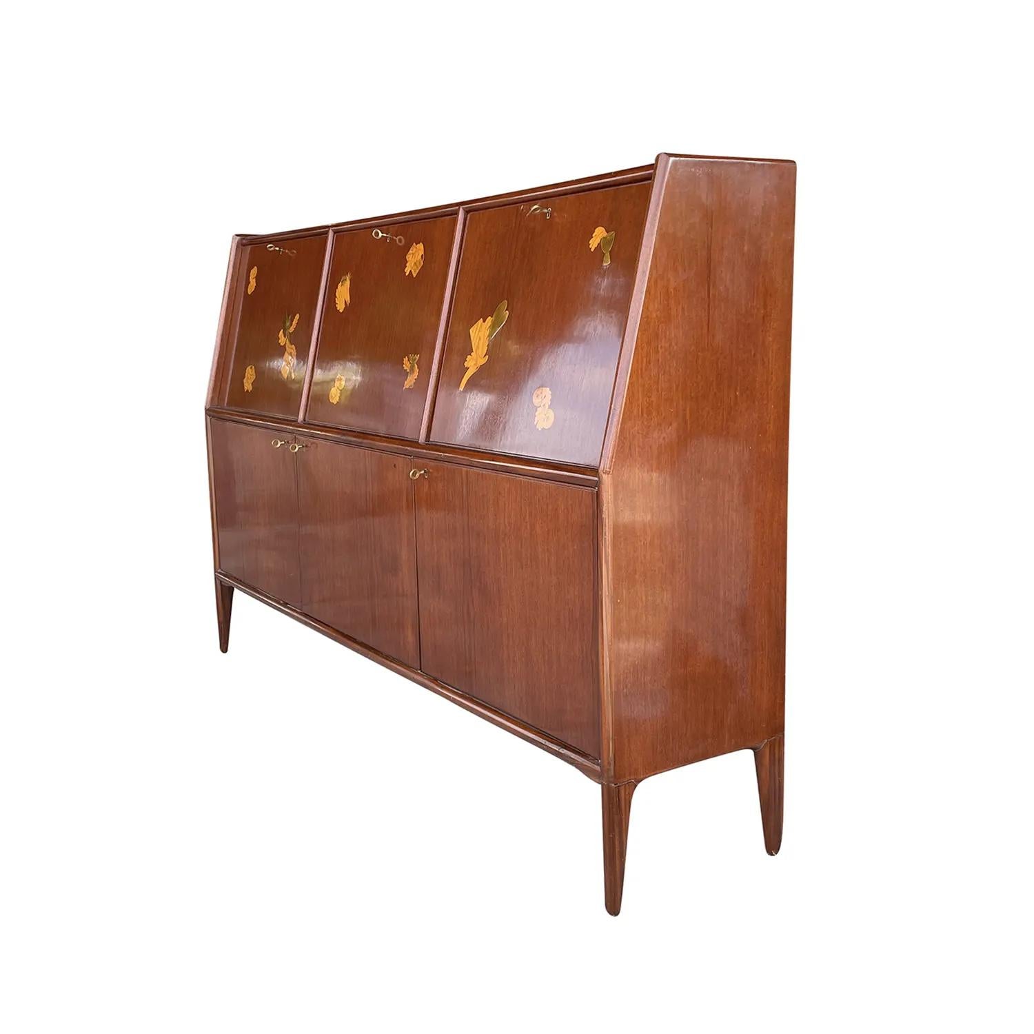 A light-brown, large vintage Mid-Century Modern, finely worked Italian secretaire, designed by Paolo Buffa and Giovanni Gariboldi in good condition. The inlays of the large rectangular writing desk, table is made of hand carved Rosewood, the