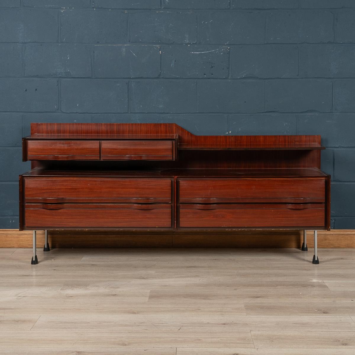 A delightful rosewood sideboard or chest of drawers produced in the 1960's by La Sorgente dei Mobili in Arosio near Milan, Italy. The drawers open to reveal a lovely light wood veneers interior (possibly cedar wood) which really shows the attention