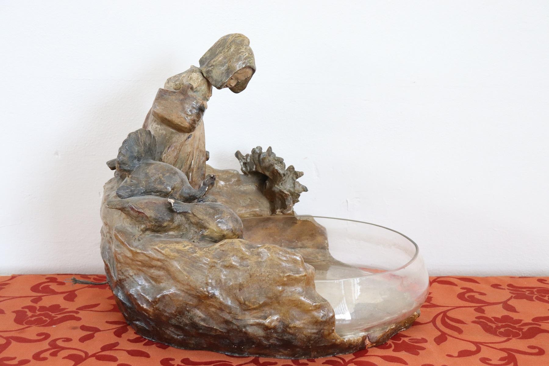 A fine plaster sculpture of a girl with ducks at a lake. The large glass bowl was intended to hold water. The sculpture can be illuminated the electrical system must be restored. Please look at every detail of the sweet face of the little girl who