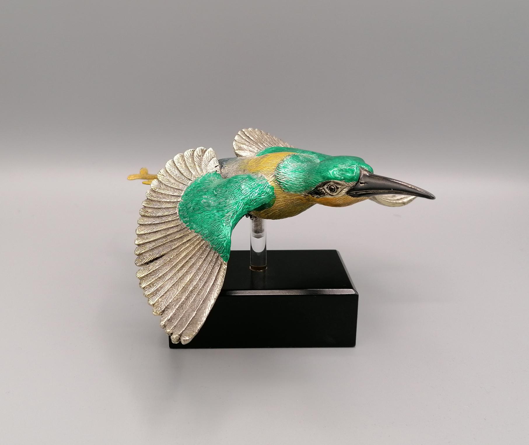 Resin sculpture depicting the Bee-Eater covered in pure 999 silver. Made by the Etruria silver factory in Florence at the end of the 20th century.
The finish is hand-enameled in green, yellow, silver and black.
The sculpture is placed on a