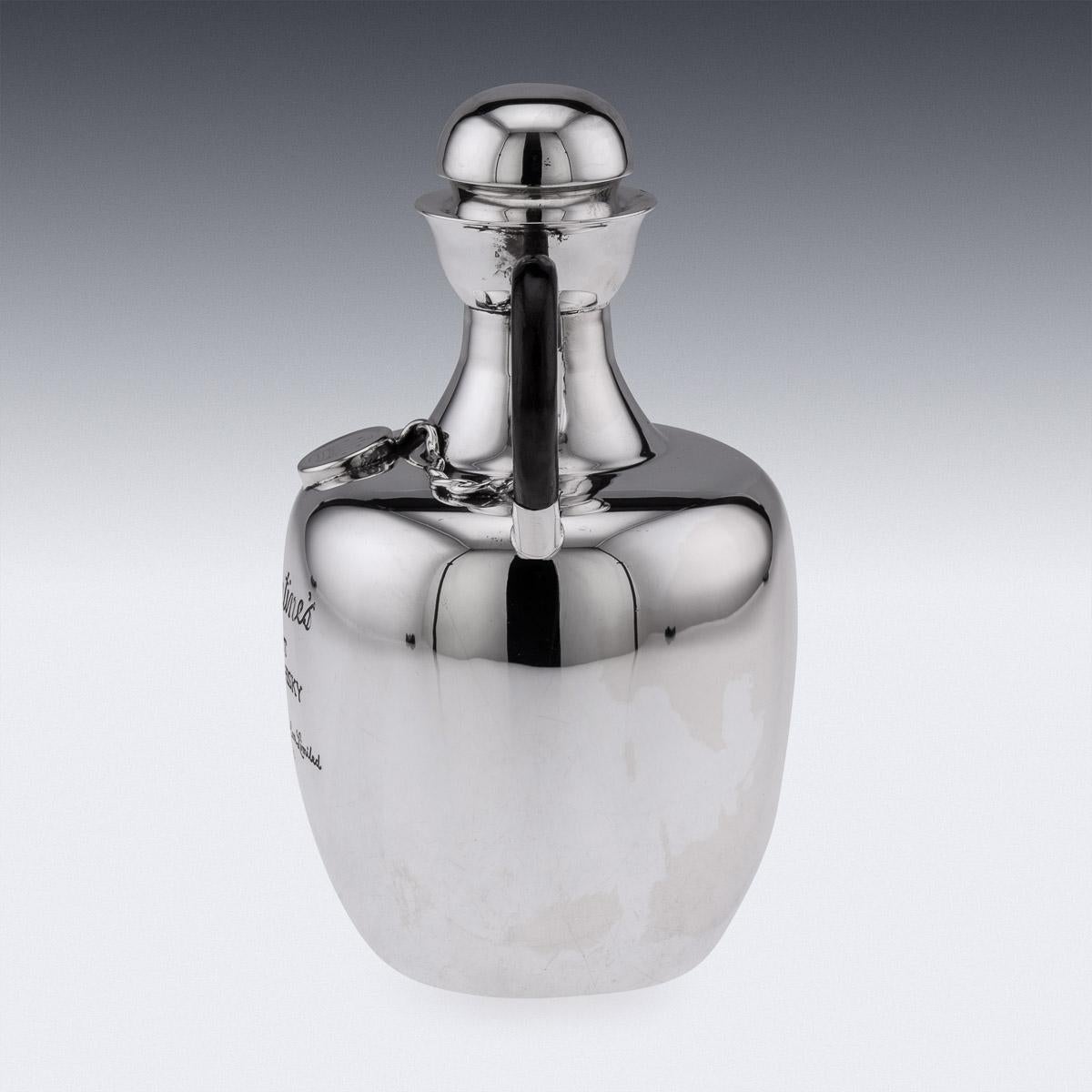 20th Century Italian silver whisky decanter. Mounted with a C-shaped ebonised handle and removable lid. The plain decanter engraved 