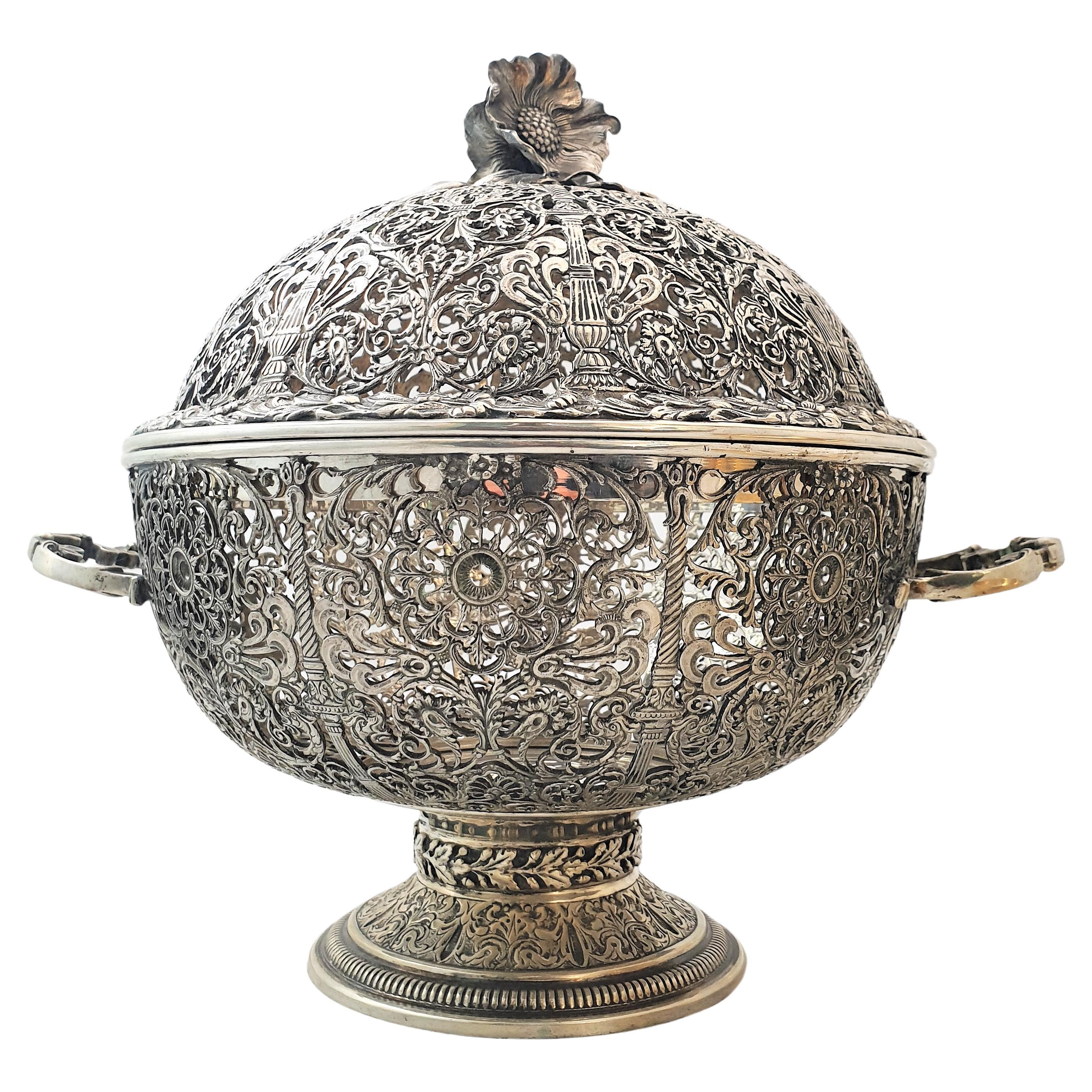 Wonderful basket centerpiece with cover. 

Realized By Messulam Silversmith in Milan, Italy around 1950s

Realized in silver and gilt silver with an excellent fretwork

Fret base, with inside bowl (gilt) and fret cover with flower finial