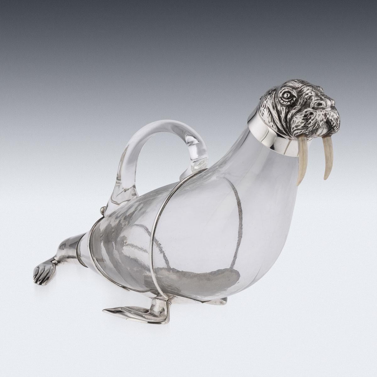 20th Century Italian silver & glass novelty wine decanter, the blown glass body and silver head beautifully imitating a walrus, the head made in two section with a hinged lid and mounted with tusks.
Hallmarked Italian Silver (925 Standard), Milan,