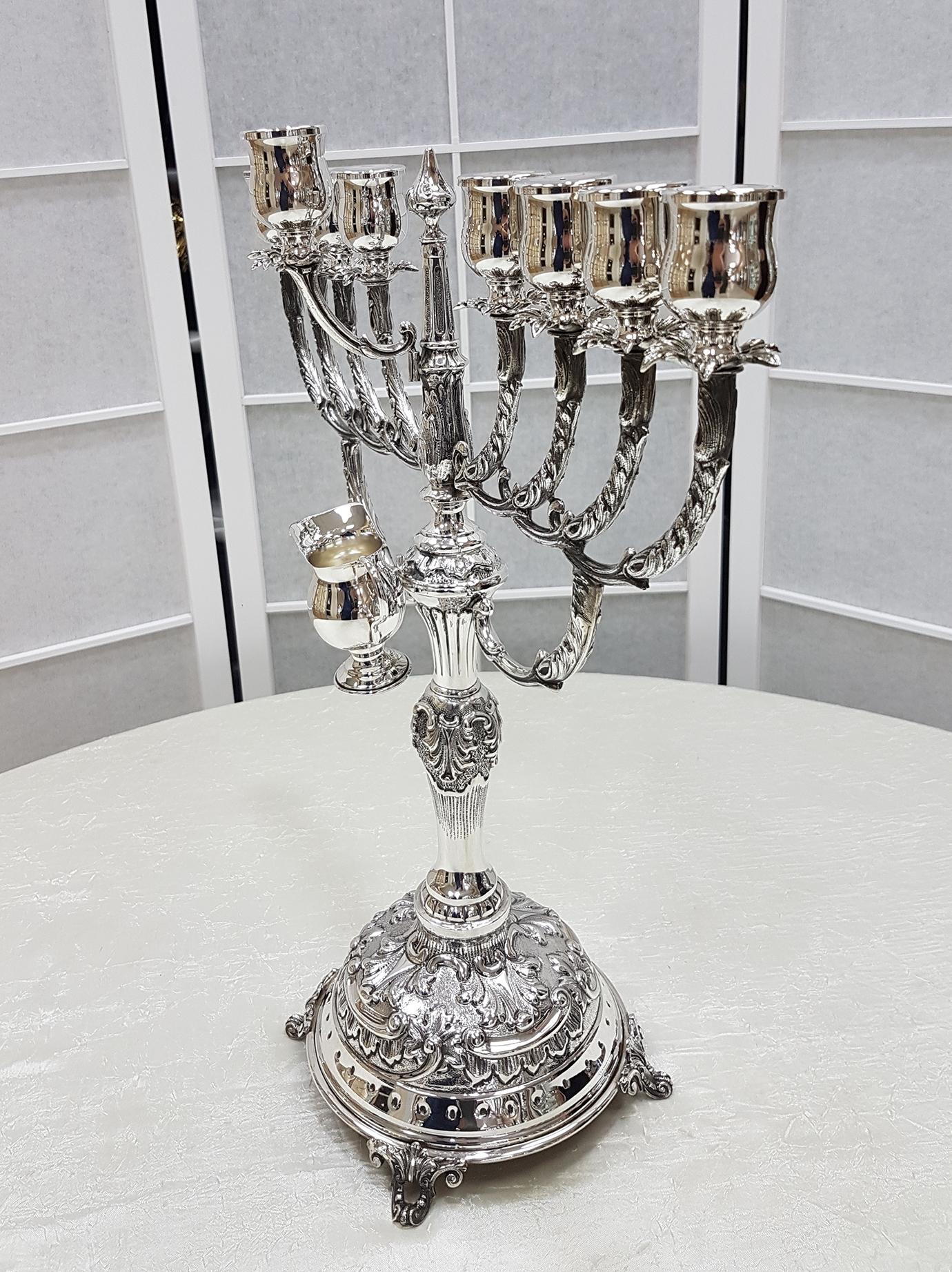 The Hanukkah menorah, also chanukiah or hanukkiah is a nine-branched candelabrum lit during the eight-day holiday of Hanukkah, as opposed to the seven-branched menorah used in the ancient Temple or as a symbol. 

On each night of Hanukkah, a new