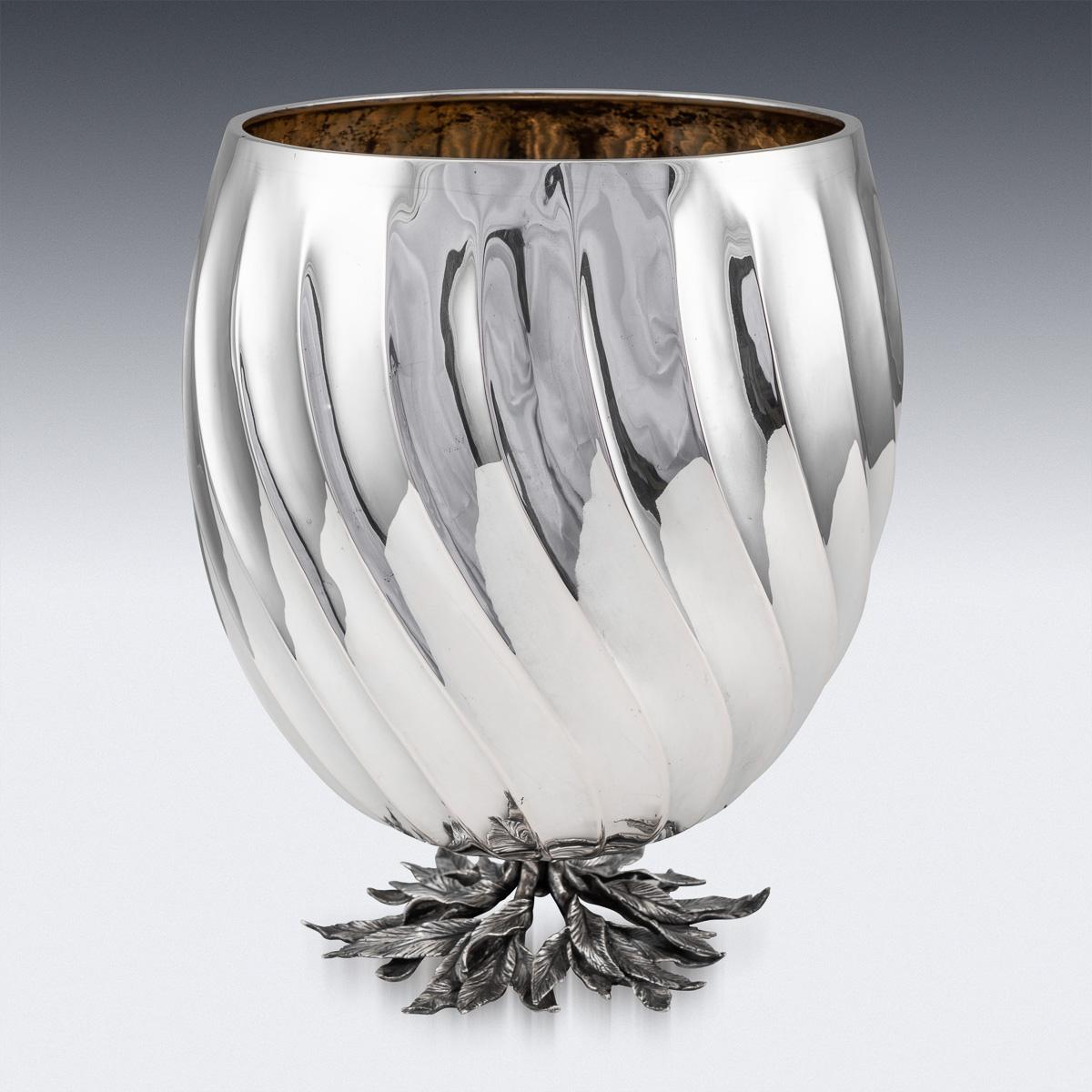 Elegant 20th century Italian solid silver wine cooler, the body applied with a decorative half fluted inverted bands, the foot applied with realistically modelled leafes and richly gilt interior. Hallmarked Italian silver (800 standard), Maker