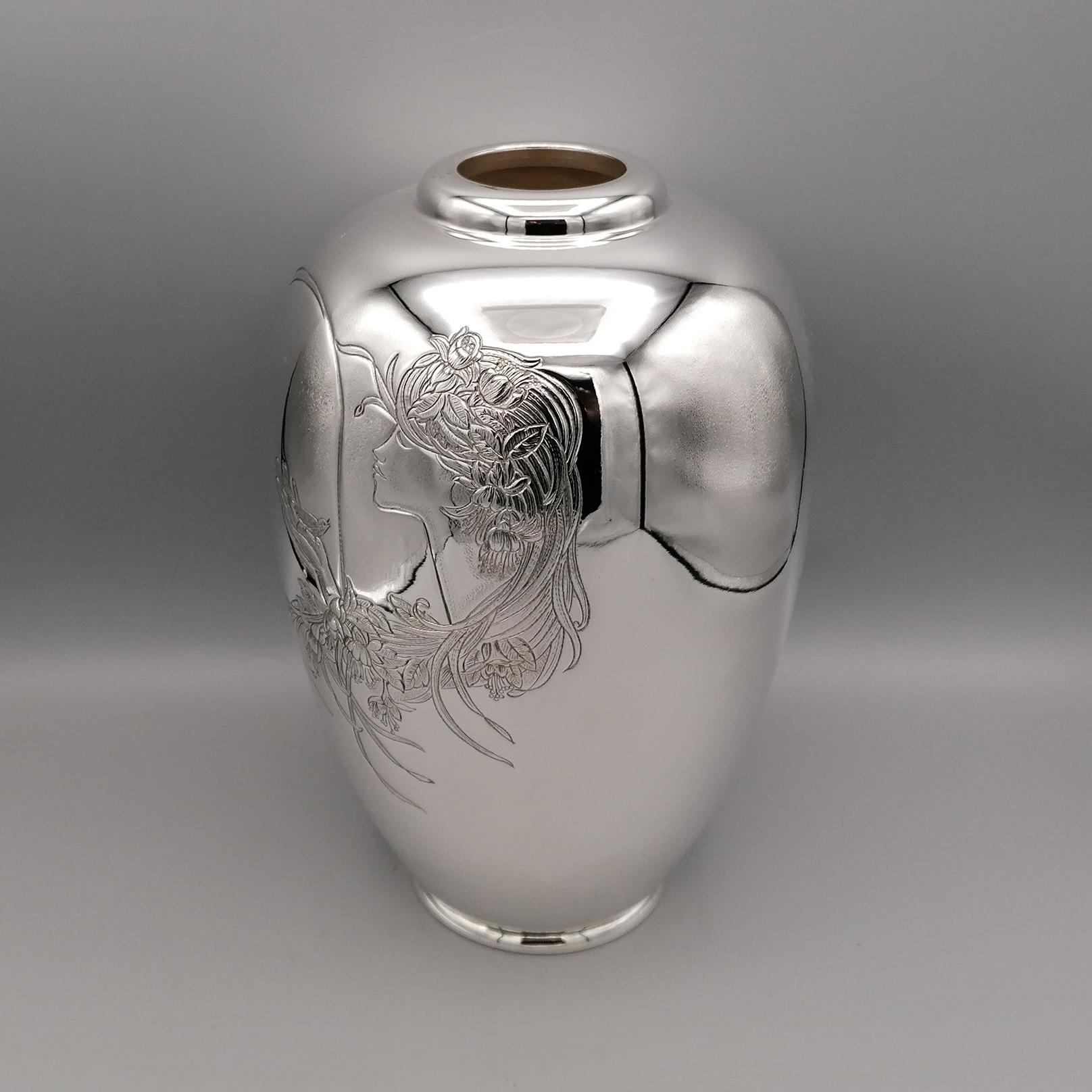 Vase in 800 solid silver.
The shape of the vase is round, pot-bellied and has been made with a smooth and glossy finish.
The vason was embellished with a hand engraving depicting an oriental woman with long hair decorated with flowers.
The female