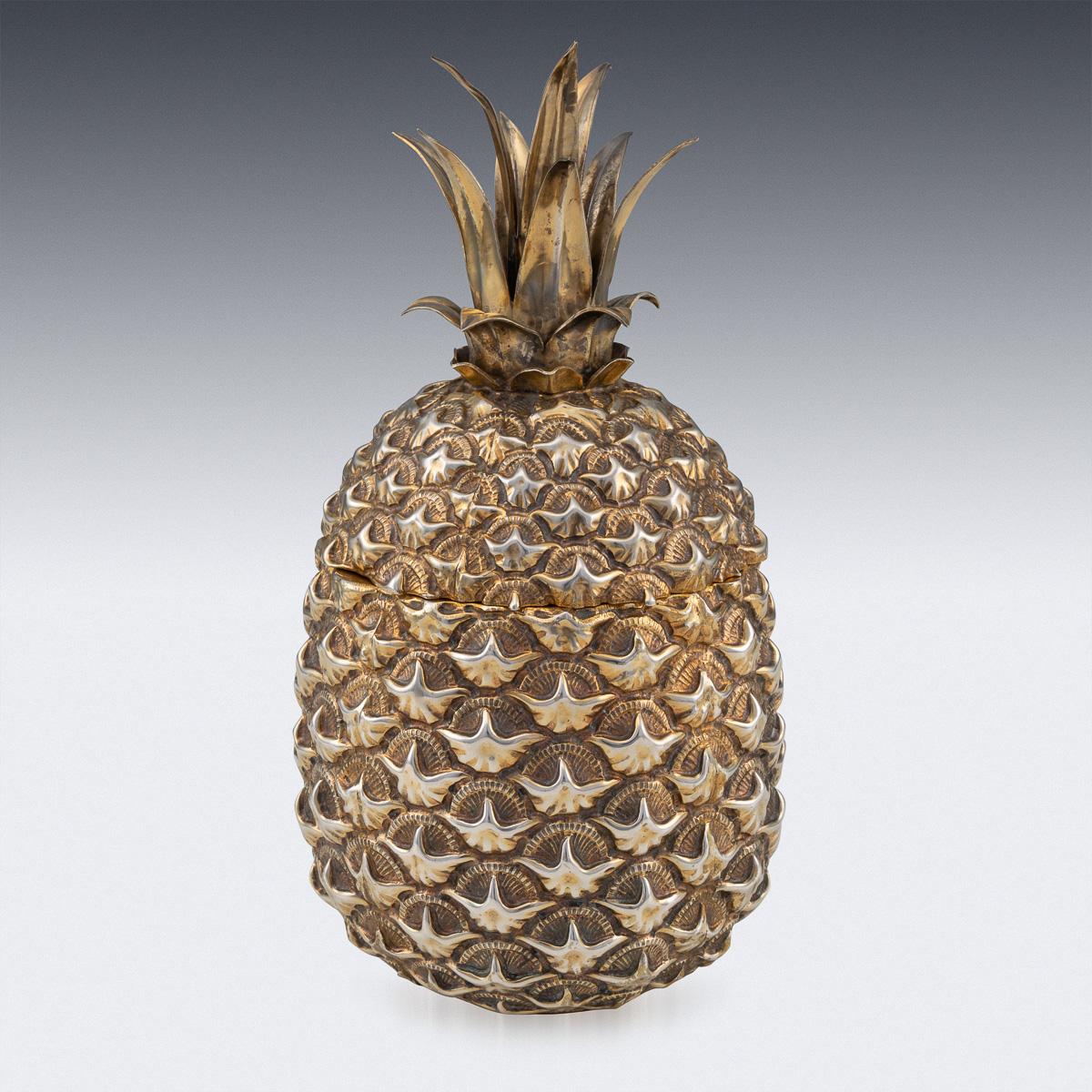 Novelty 20th century Italian solid silver-gilt ice bucket, in a form of a pineapple, removable lid mounted with realistically modelled leaves and richly gilt interior. Hallmarked Italian silver.

Condition

In great condition - No damage, just