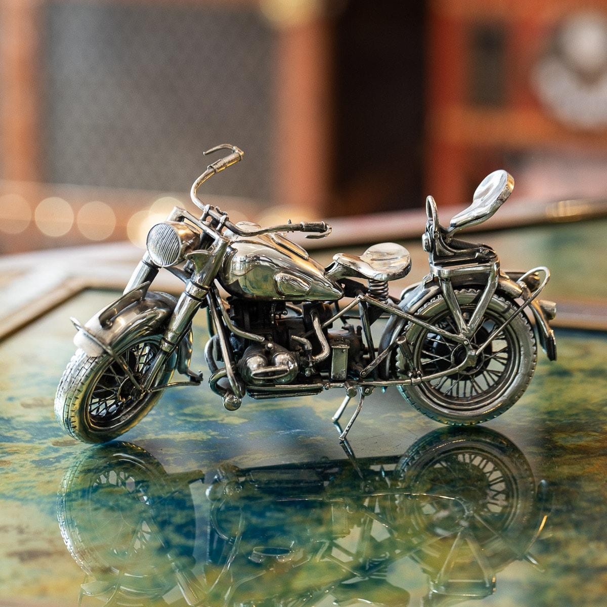 Superb 20th Century Italian solid silver model of a BMW R75 motorcycle. The scaled down model finely hand crafted by Italians finest silversmiths to the very last detail, with rotating silver tyres, moving handlebars and sprung seats. A truly superb