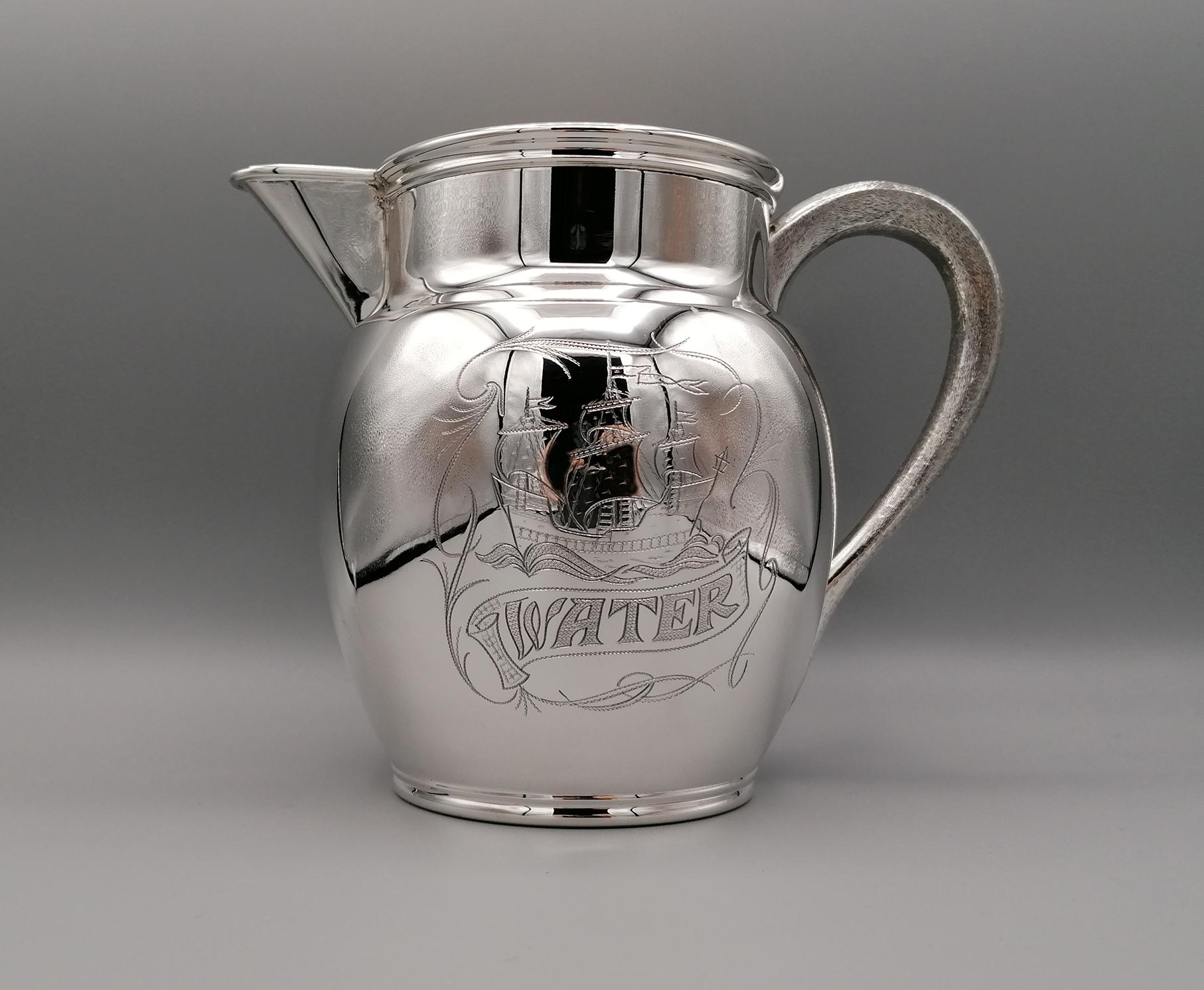 Solid silver water jug. His body is smooth where the inscription 