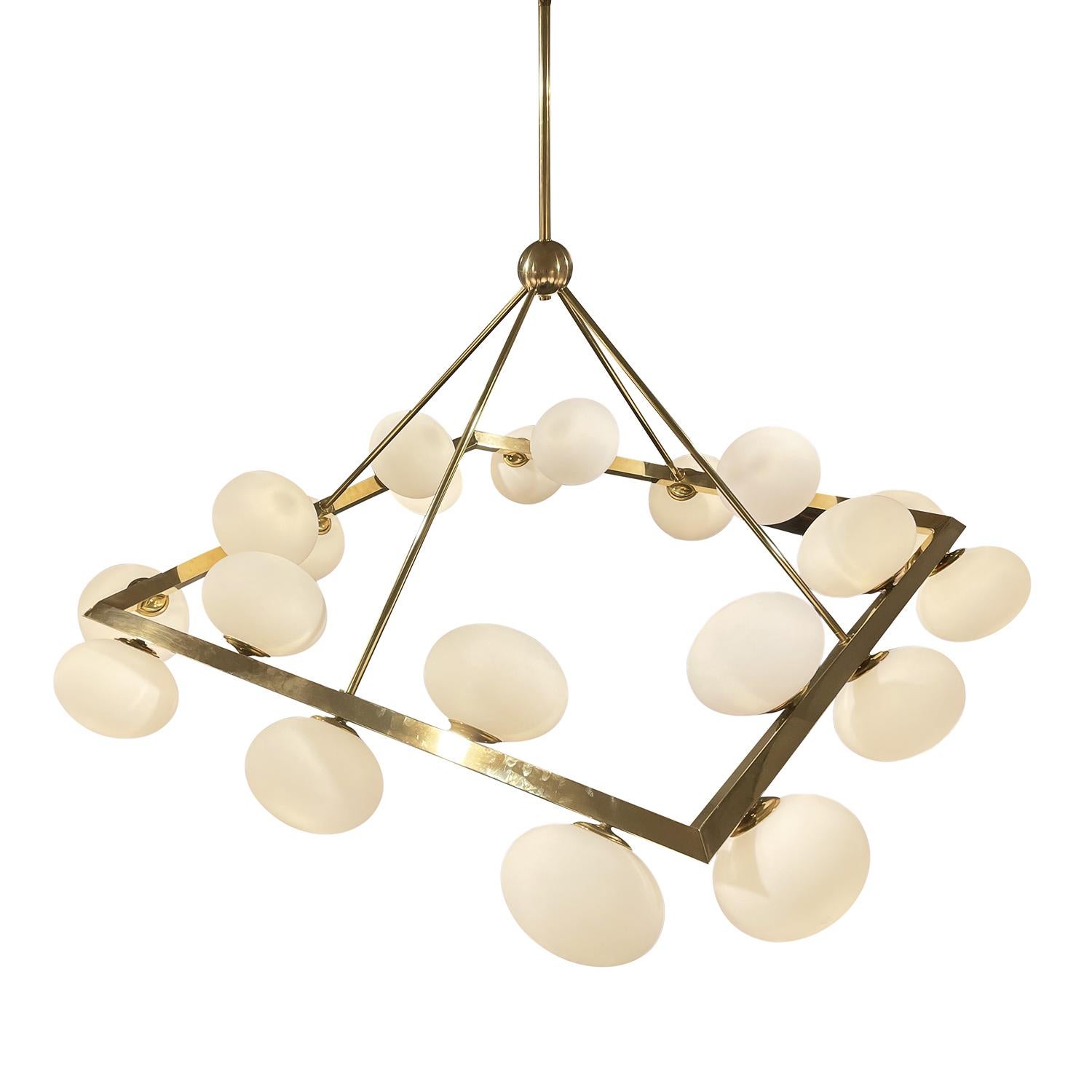 A gold, vintage Mid-Century Modern Italian square chandelier, pendant made of hand blown frosted opaline glass, designed and produced most likely by Stilnovo in good condition. Each glass shade of the detailed ceiling light, lamp is halted by a