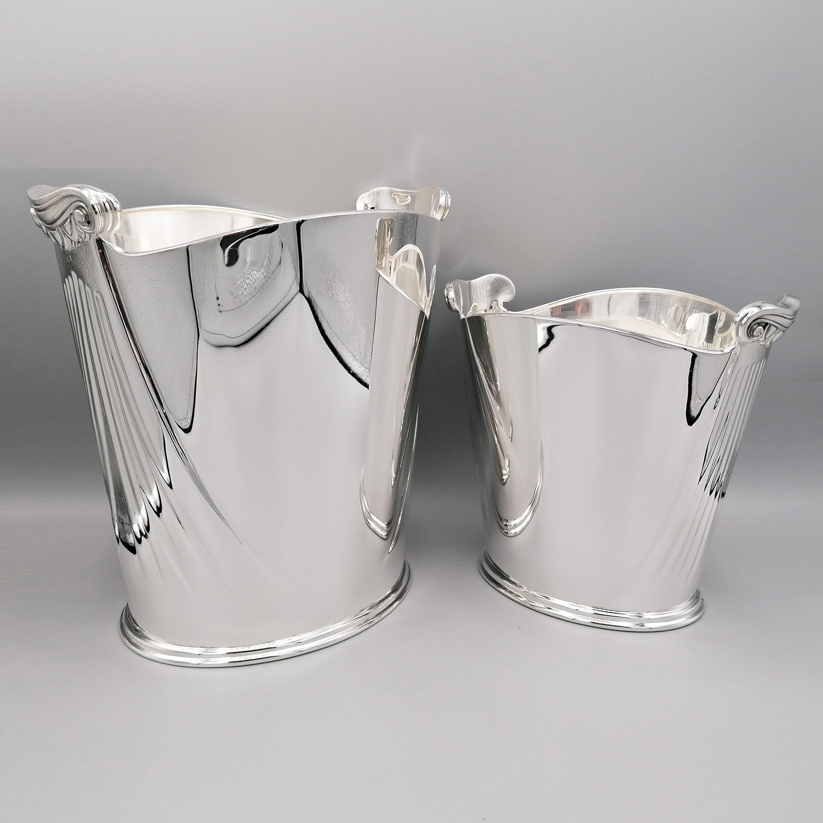 Gourgeous sterling silver champagne and ice bucket.
Buckets of oval shape and made entirely by hand, have been embossed and chiseled with ribs reproducing the grooves of the columns and completed with casting in silver that reproduce the Ionic