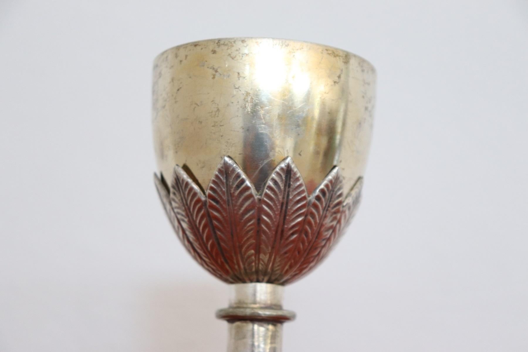 Italian sterling silver Chalice finely embossed and chiselled 800 punch at the base. cup in golden bath.
Weight gr 335.
 