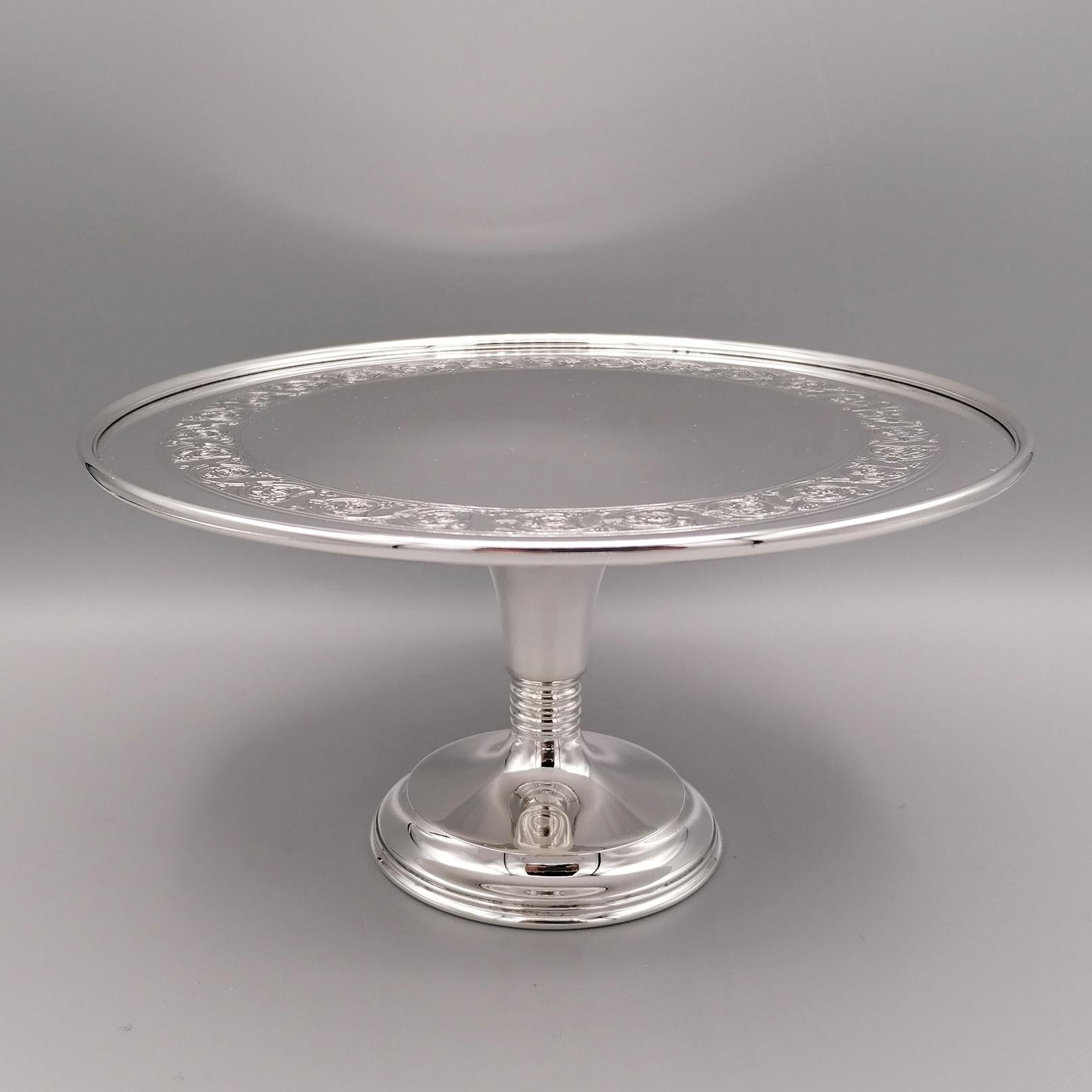 Italian sterling silver stand made in the 80s of the last century. 
The structure of the object is very simple, with a smooth double-stepped base. 
In the stem of the base, small lines have been made to reinforce it and make it stable also to